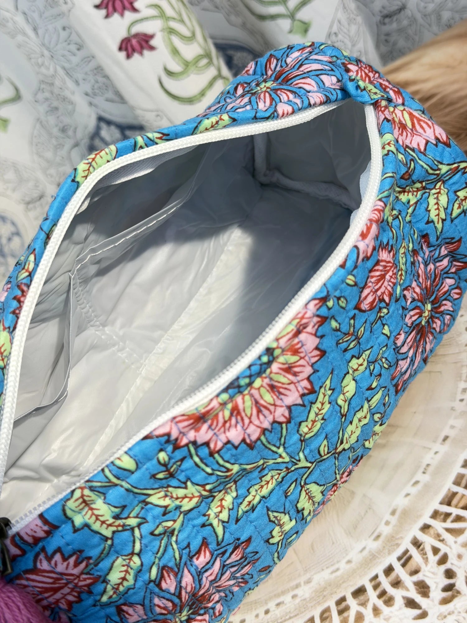 Jaipur Block Print Cotton Quilted Toiletry Pouch in blue floral print, 10 × 6 inch zip pouch for travel and daily use side view