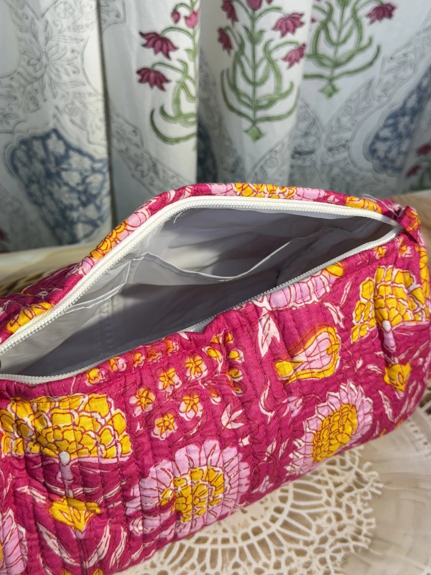 Jaipur Block Print Cotton Quilted Toiletry Pouch in pink floral print, 10 × 6 inch zip pouch for toiletries and personal care items side view