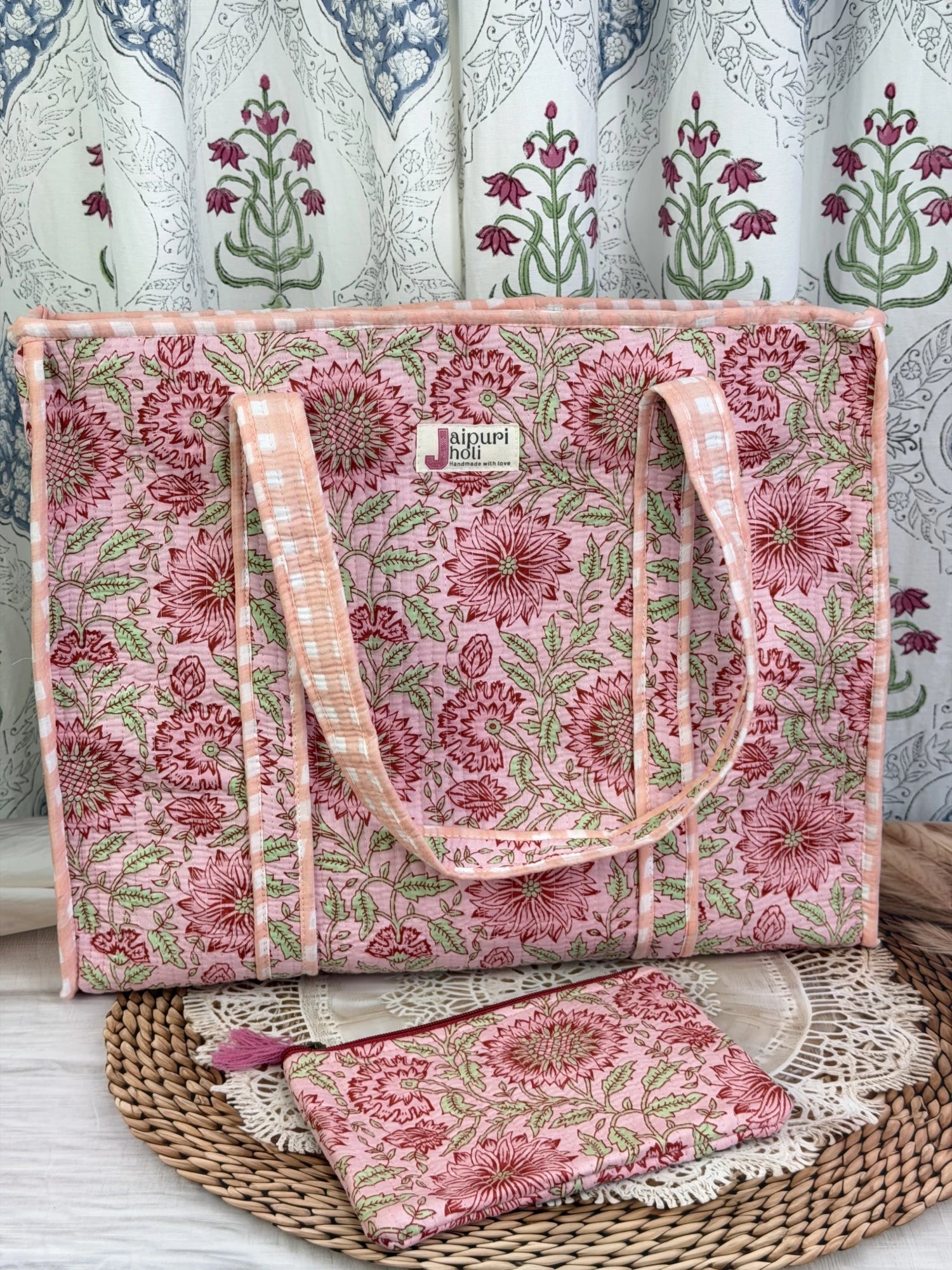 Jaipur block print cotton quilted large tote bag with matching flat pouch, peach and pink floral print, 18×18×6 inch tote with 9×7 inch flat pouch for cosmetics, documents and small essentials front view