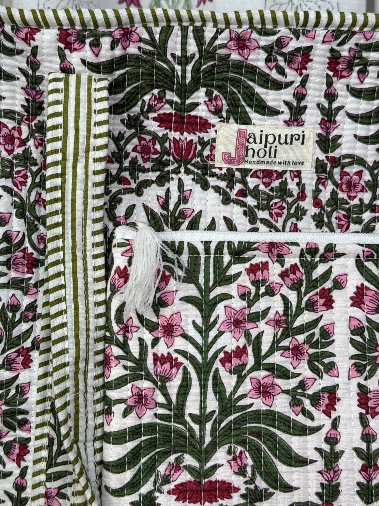 Jaipur block print cotton quilted large tote bag with matching flat pouch, pink floral and green leaf print, 18×18×6 inch tote with 9×7 inch flat pouch for documents, chargers and everyday essentials close-up view