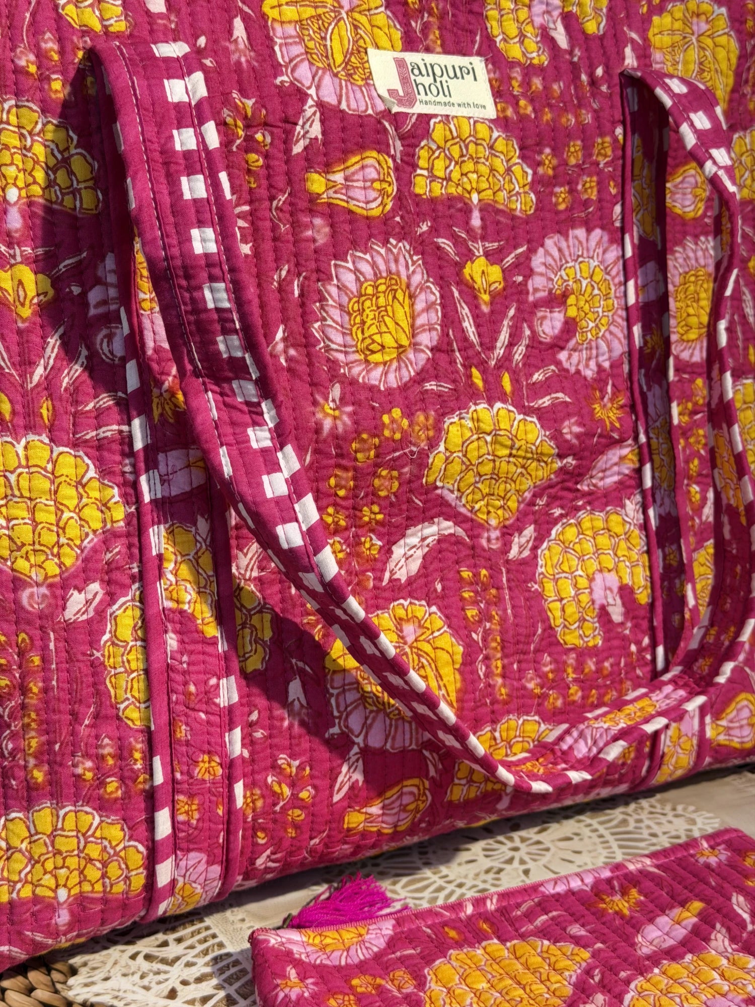 Jaipur block print cotton quilted large tote bag with matching flat pouch, pink floral print, 18×18×6 inch tote with 9×7 inch flat pouch for stationery, cosmetics and travel essentials close-up view