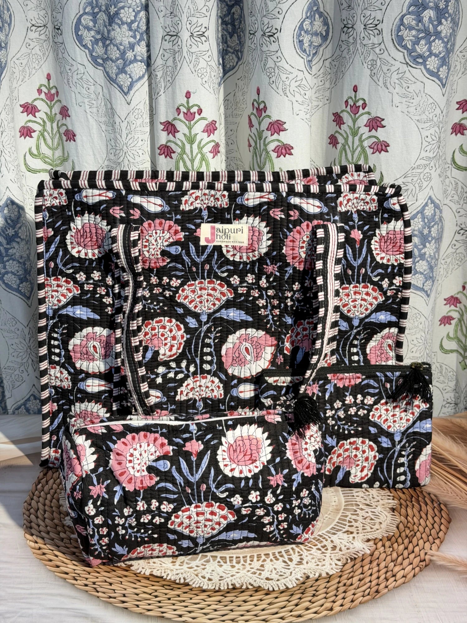 Jaipur block print cotton quilted large zip tote bag with matching toiletry pouch and flat pouch, black and pink floral print, 18 × 18 × 6 inch tote, 10 × 6 inch toiletry pouch and 9 × 7 inch flat pouch front view