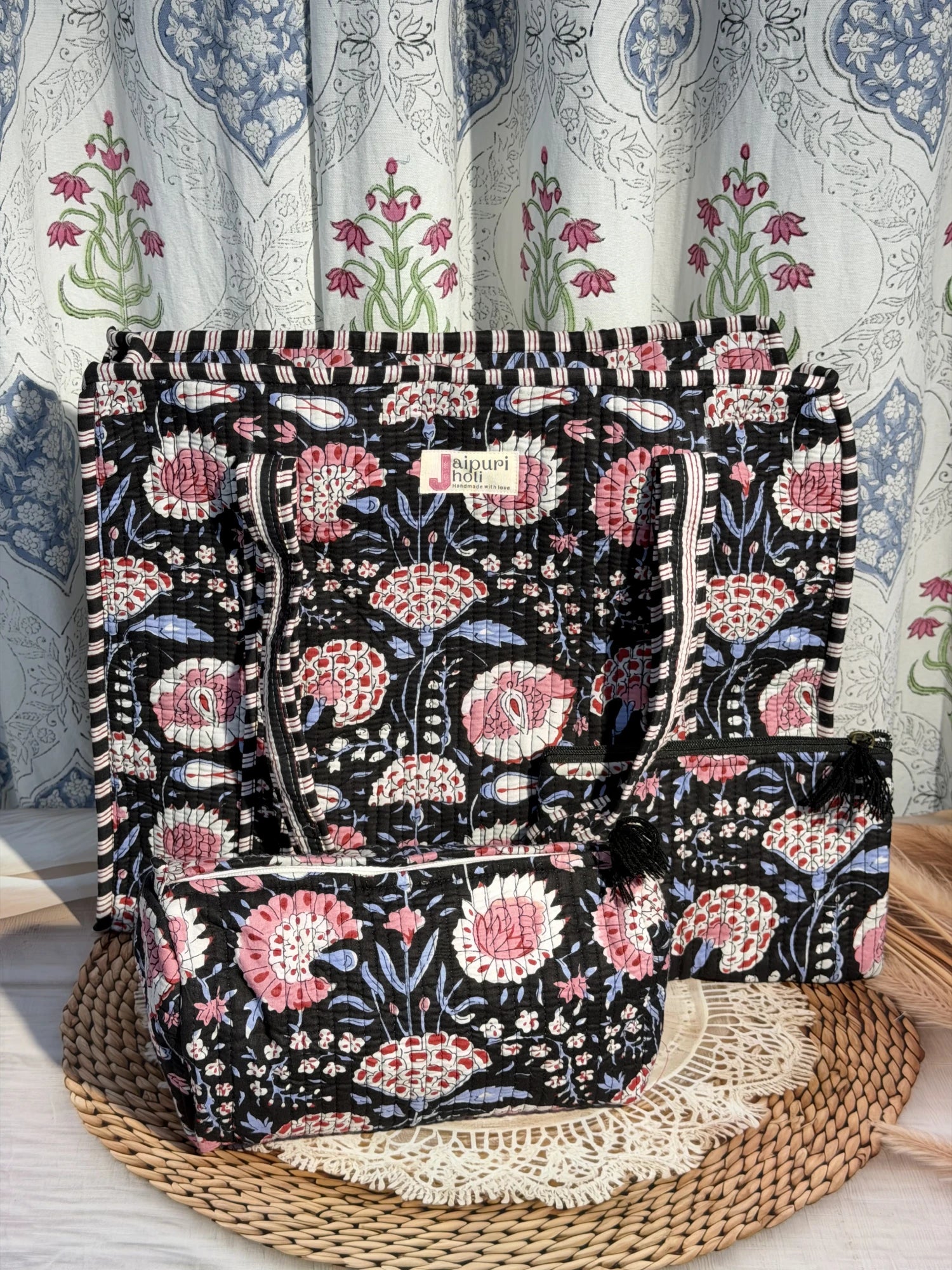 Jaipur block print cotton quilted large zip tote bag with matching toiletry pouch and flat pouch, black and pink floral print, 18 × 18 × 6 inch tote, 10 × 6 inch toiletry pouch and 9 × 7 inch flat pouch side view