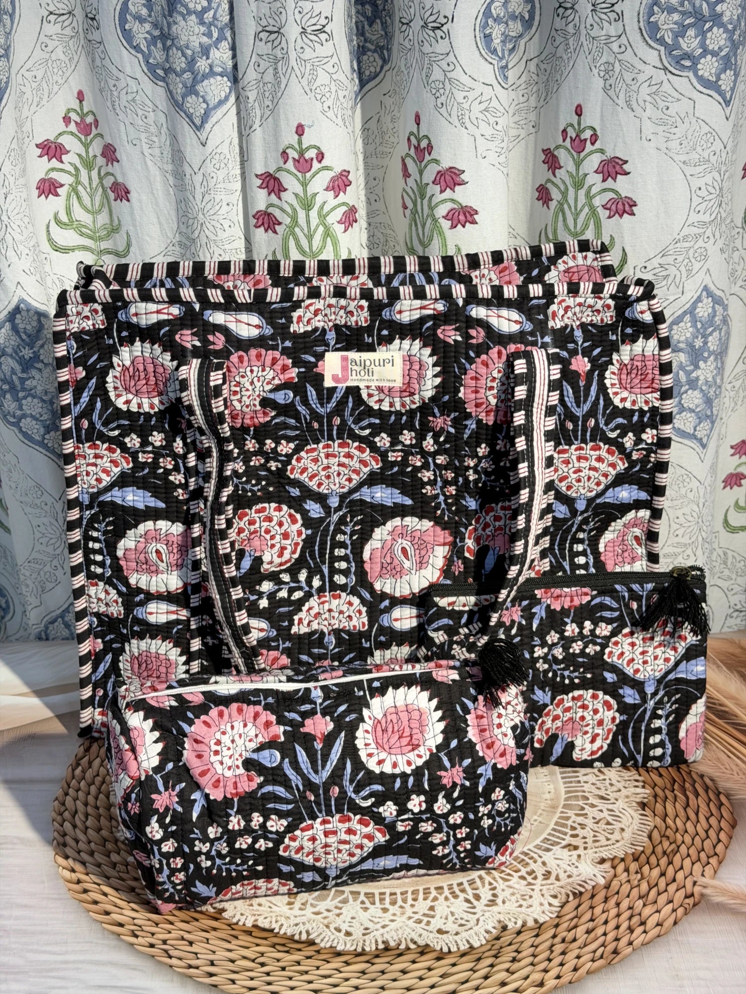 Jaipur block print cotton quilted large zip tote bag with matching toiletry pouch and flat pouch, black and pink floral print, 18 × 18 × 6 inch tote, 10 × 6 inch toiletry pouch and 9 × 7 inch flat pouch back view