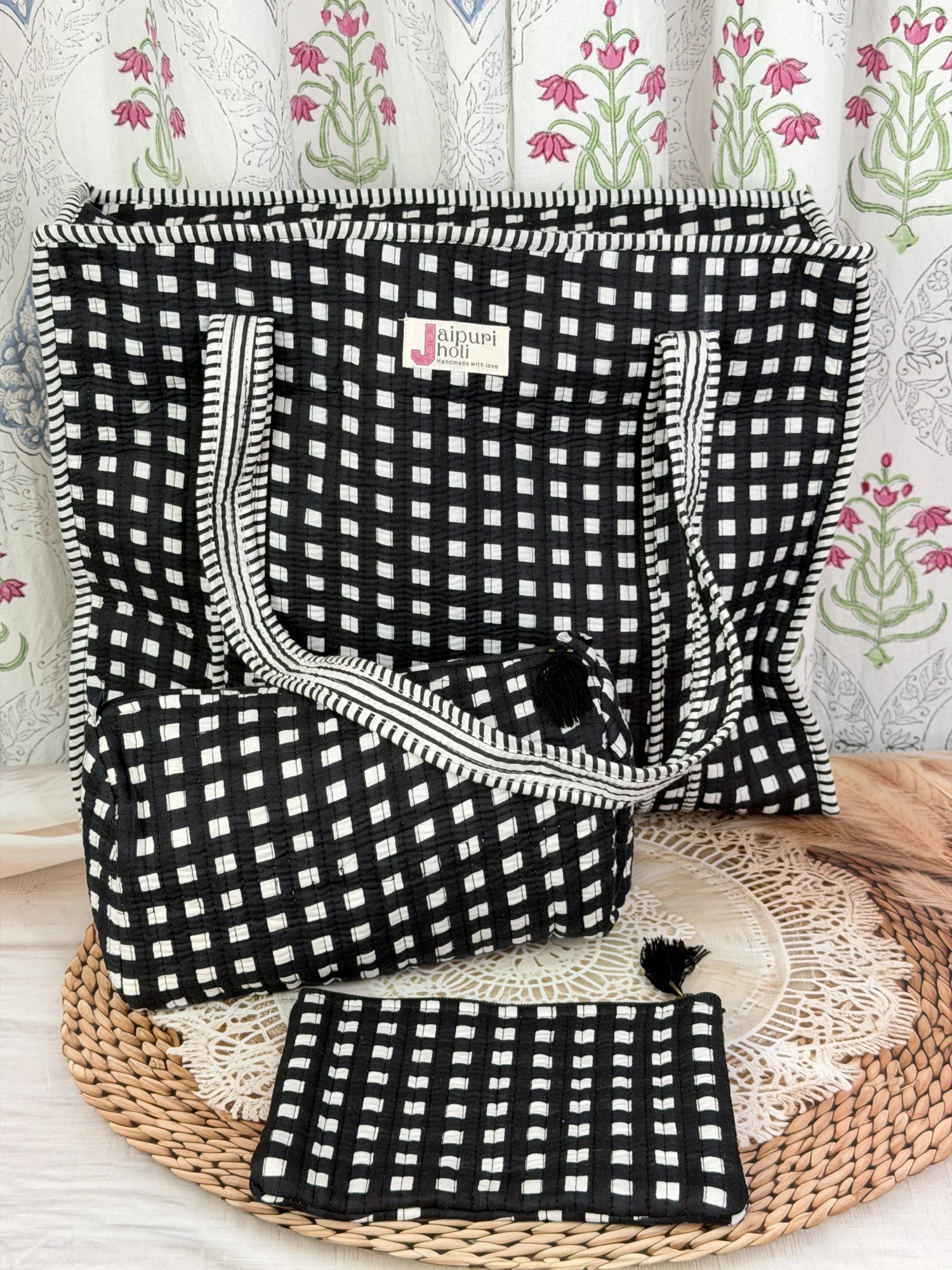 Jaipur block print cotton quilted large zip tote bag with matching toiletry pouch and flat pouch, black and white geometric check print, 18 × 18 × 6 inch tote, 10 × 6 inch toiletry pouch and 9 × 7 inch flat pouch front view