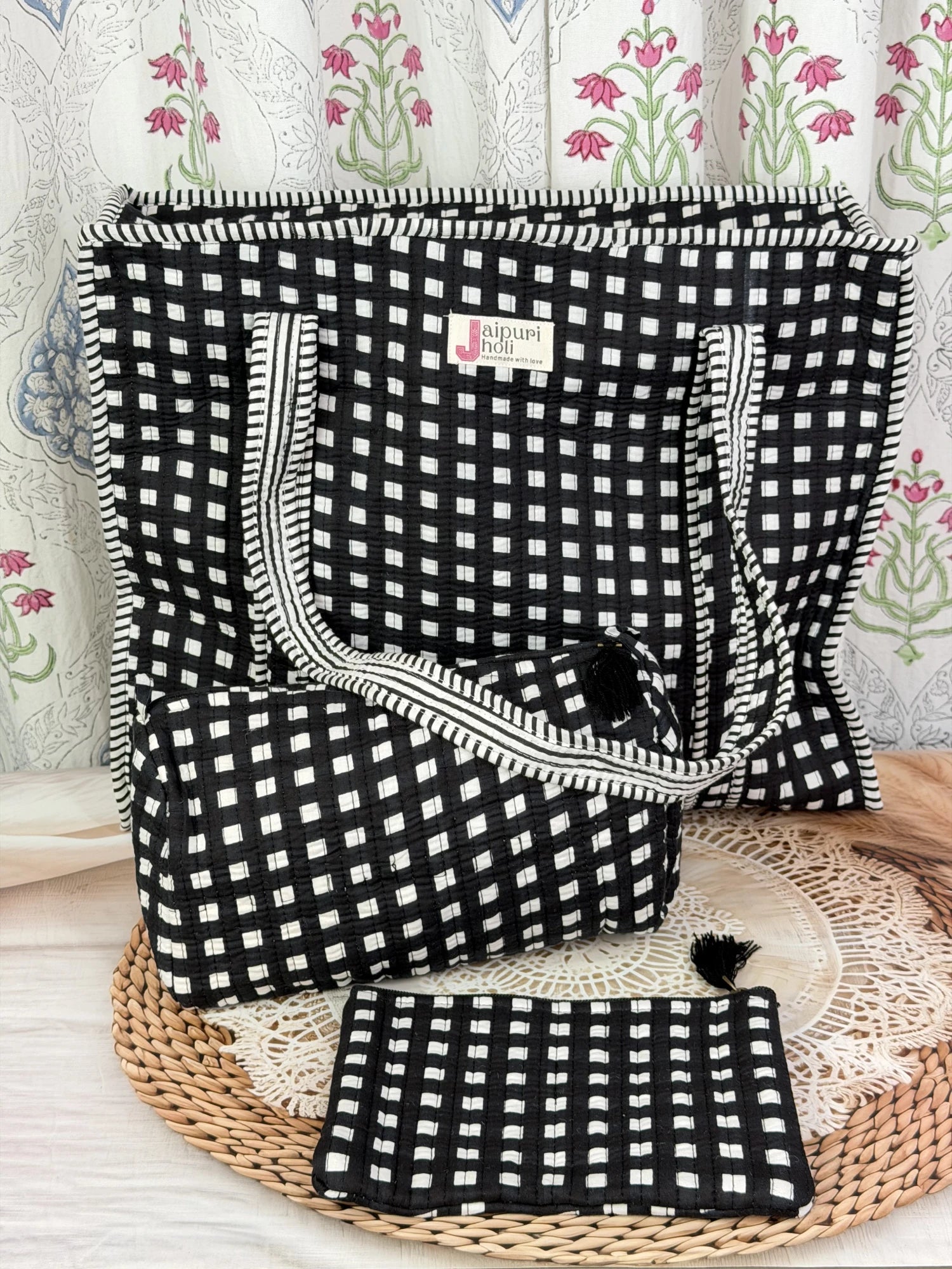Jaipur block print cotton quilted large zip tote bag with matching toiletry pouch and flat pouch, black and white geometric check print, 18 × 18 × 6 inch tote, 10 × 6 inch toiletry pouch and 9 × 7 inch flat pouch side view