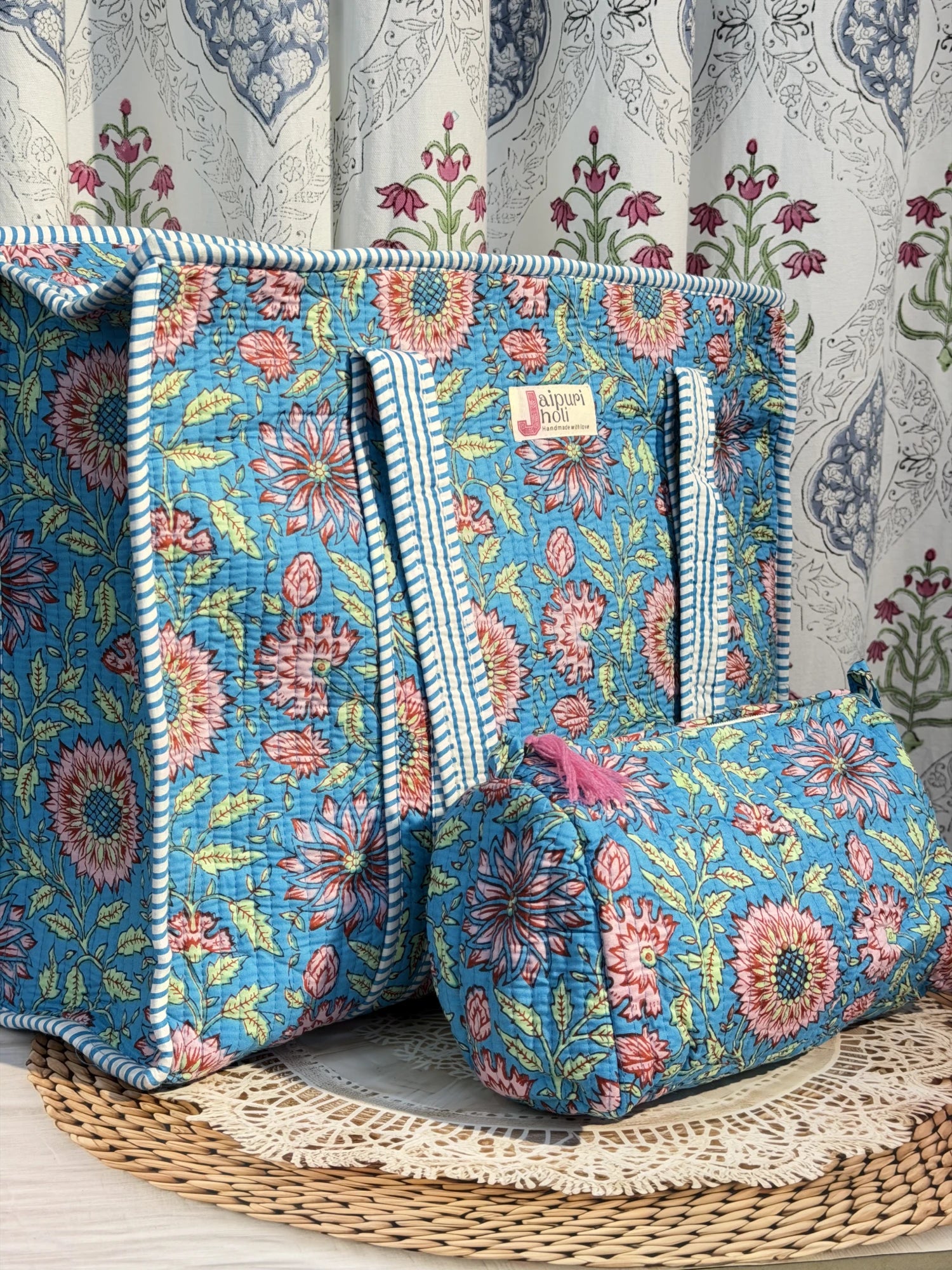 Jaipur block print cotton quilted large zip tote bag with matching toiletry pouch and flat pouch, blue floral print, 18 × 18 × 6 inch tote, 10 × 6 inch toiletry pouch and 9 × 7 inch flat pouch front view