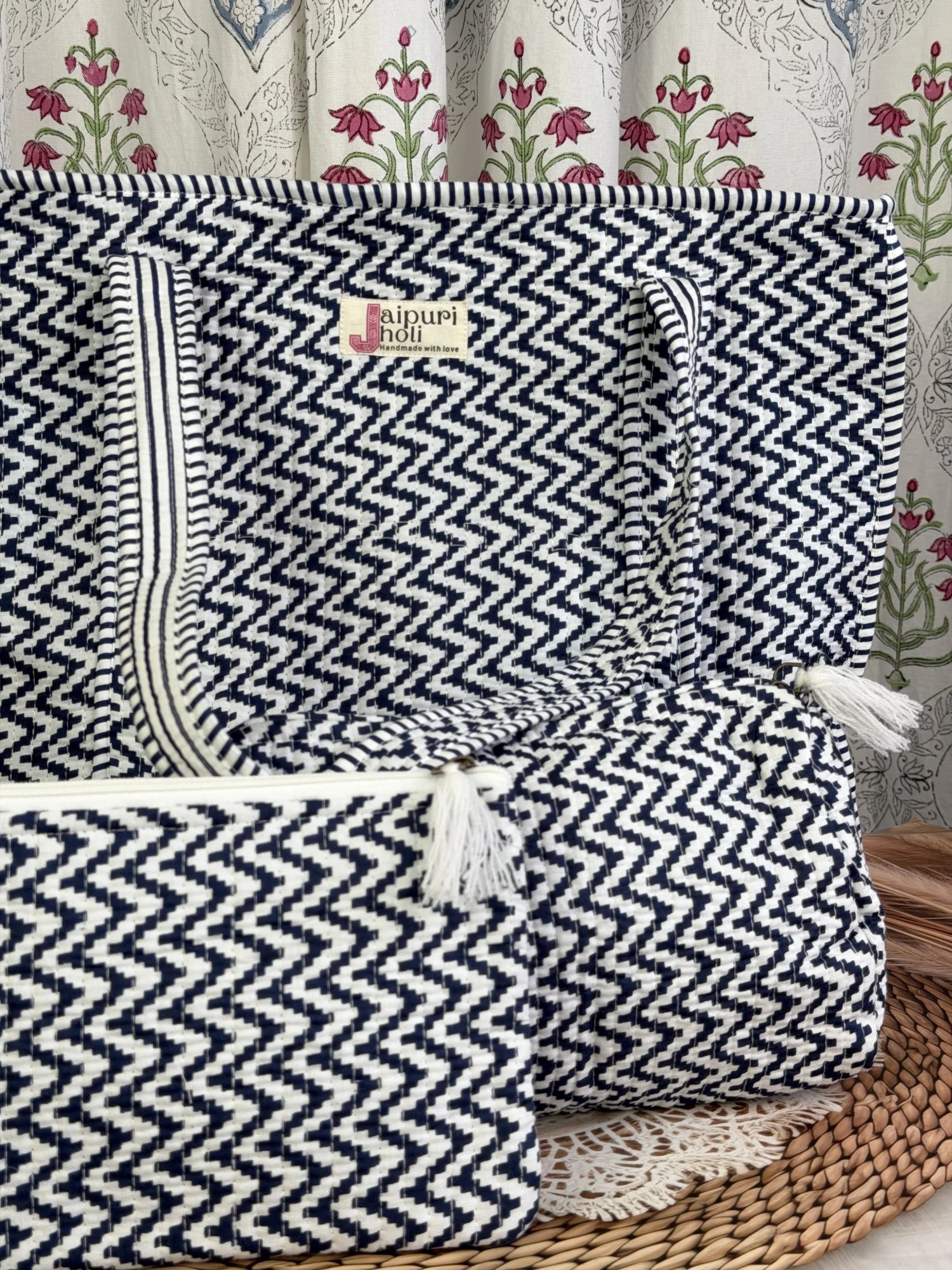 Jaipur block print cotton quilted large zip tote bag with matching toiletry pouch and flat pouch, blue and white geometric zigzag print, 18 × 18 × 6 inch tote, 10 × 6 inch toiletry pouch and 9 × 7 inch flat pouch back view