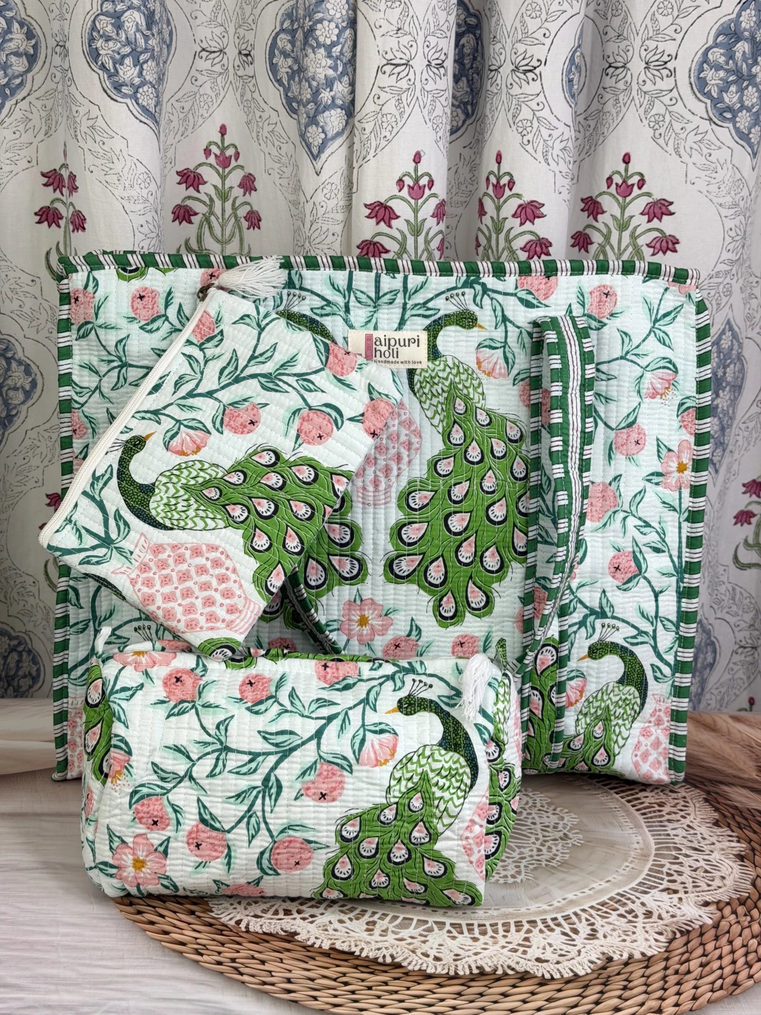 Jaipur block print cotton quilted large zip tote bag with matching toiletry pouch and flat pouch, green and pink peacock print, 18 × 18 × 6 inch tote, 10 × 6 inch toiletry pouch and 9 × 7 inch flat pouch side view