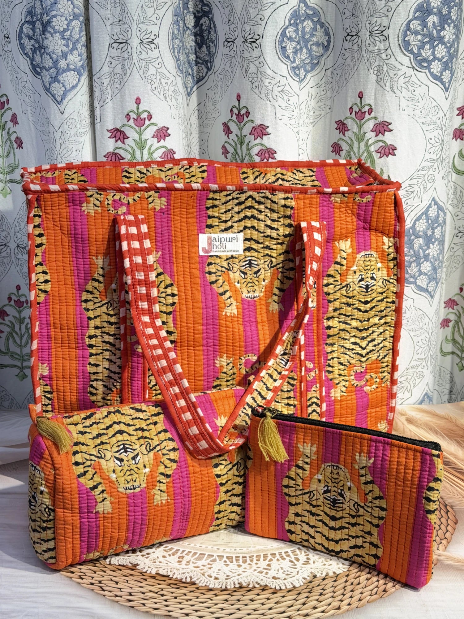 Jaipur block print cotton quilted large zip tote bag with matching toiletry pouch and flat pouch, orange and pink tiger animal print, 18 × 18 × 6 inch tote, 10 × 6 inch toiletry pouch and 9 × 7 inch flat pouch front view