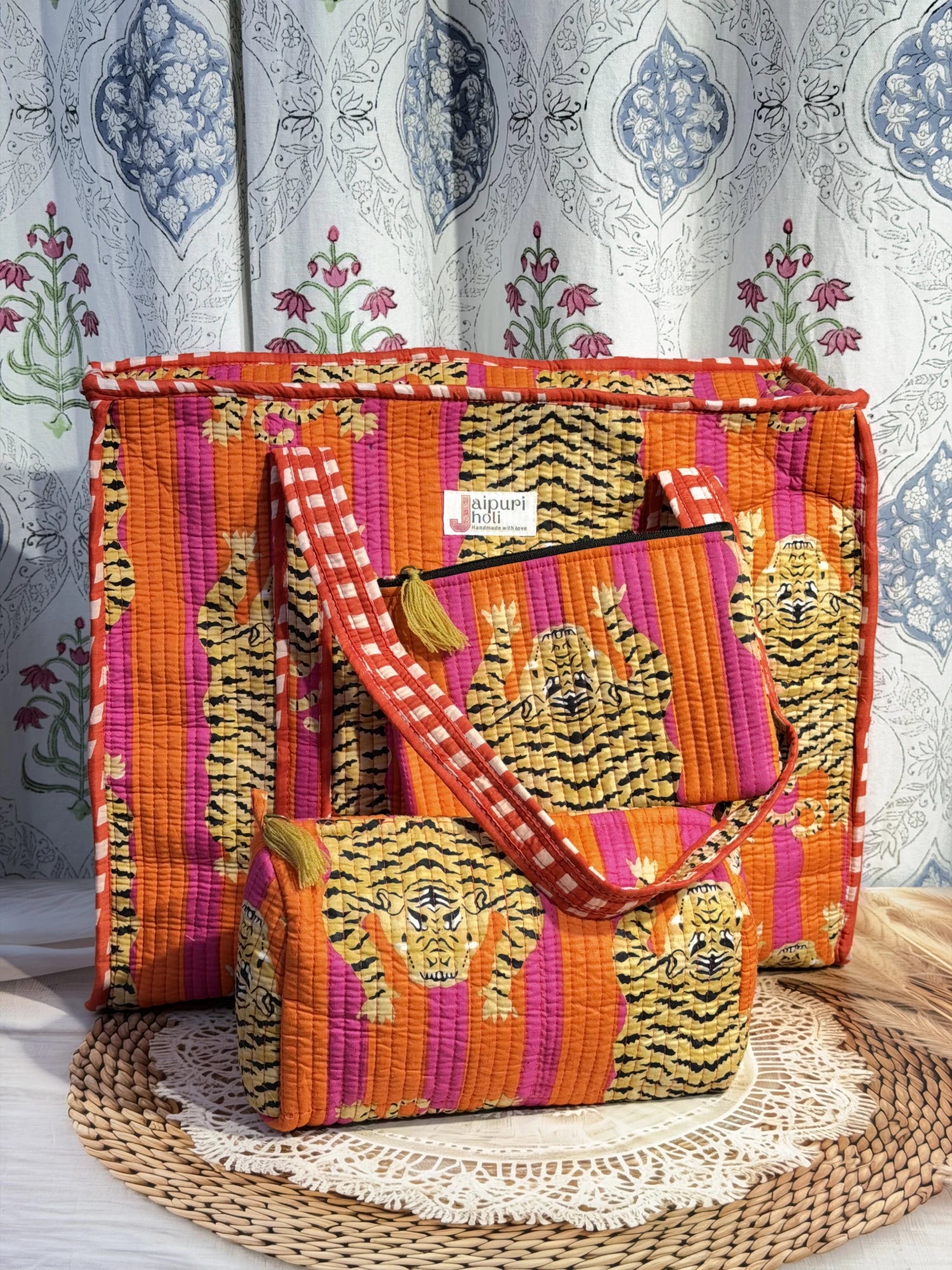 Jaipur block print cotton quilted large zip tote bag with matching toiletry pouch and flat pouch, orange and pink tiger animal print, 18 × 18 × 6 inch tote, 10 × 6 inch toiletry pouch and 9 × 7 inch flat pouch back view