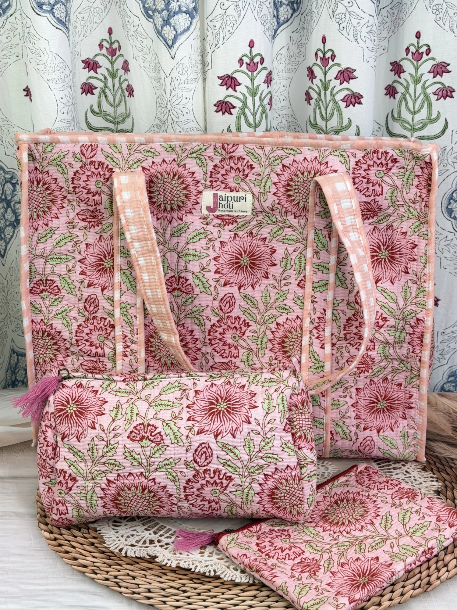 Jaipur block print cotton quilted large zip tote bag with matching toiletry pouch and flat pouch, peach and pink floral print, 18 × 18 × 6 inch tote, 10 × 6 inch toiletry pouch and 9 × 7 inch flat pouch side view