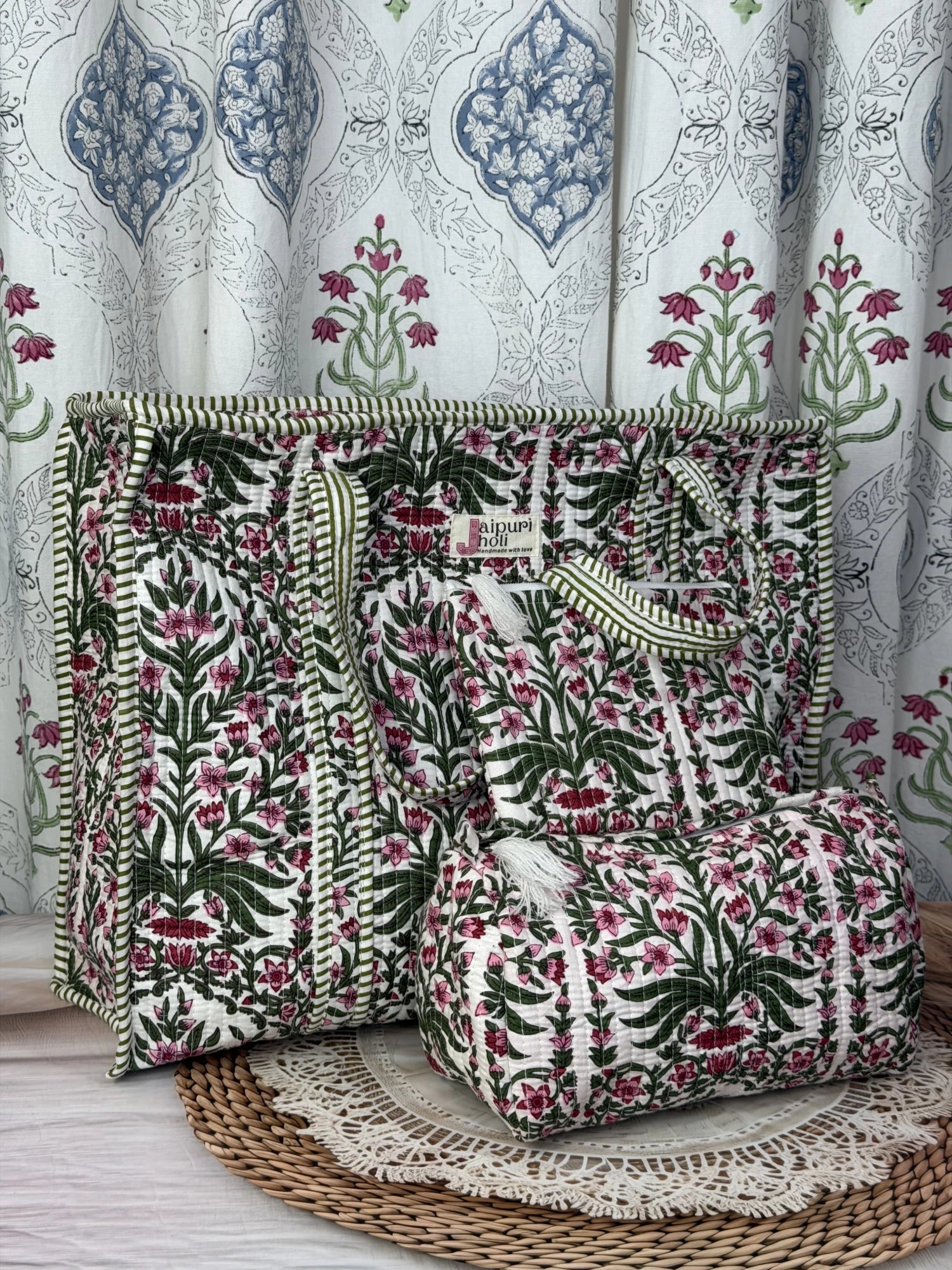 Jaipur block print cotton quilted large zip tote bag with matching toiletry pouch and flat pouch, pink floral and green leaf print, 18 × 18 × 6 inch tote, 10 × 6 inch toiletry pouch and 9 × 7 inch flat pouch back view
