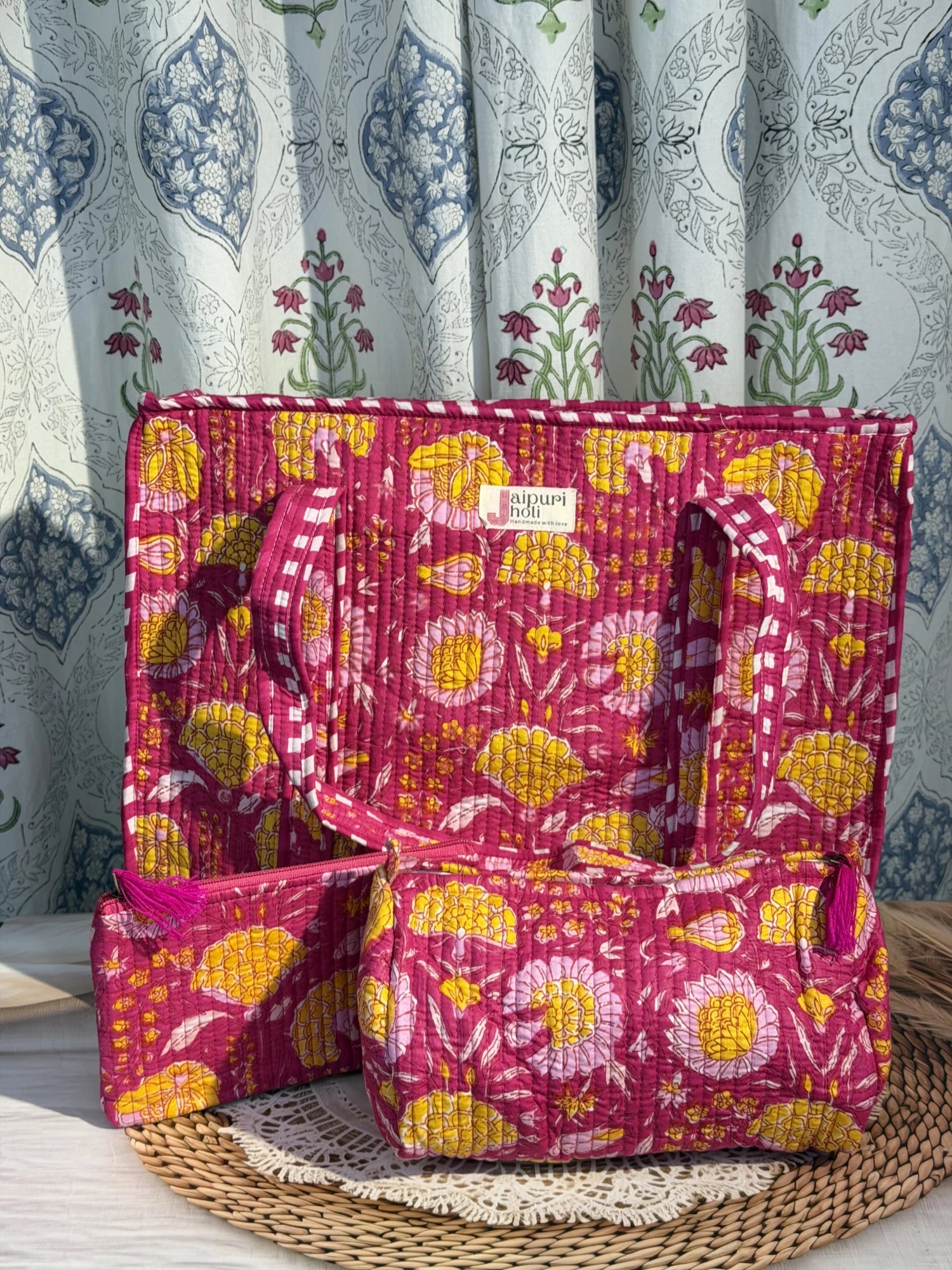 Jaipur block print cotton quilted large zip tote bag with matching toiletry pouch and flat pouch, pink floral print, 18 × 18 × 6 inch tote, 10 × 6 inch toiletry pouch and 9 × 7 inch flat pouch side view
