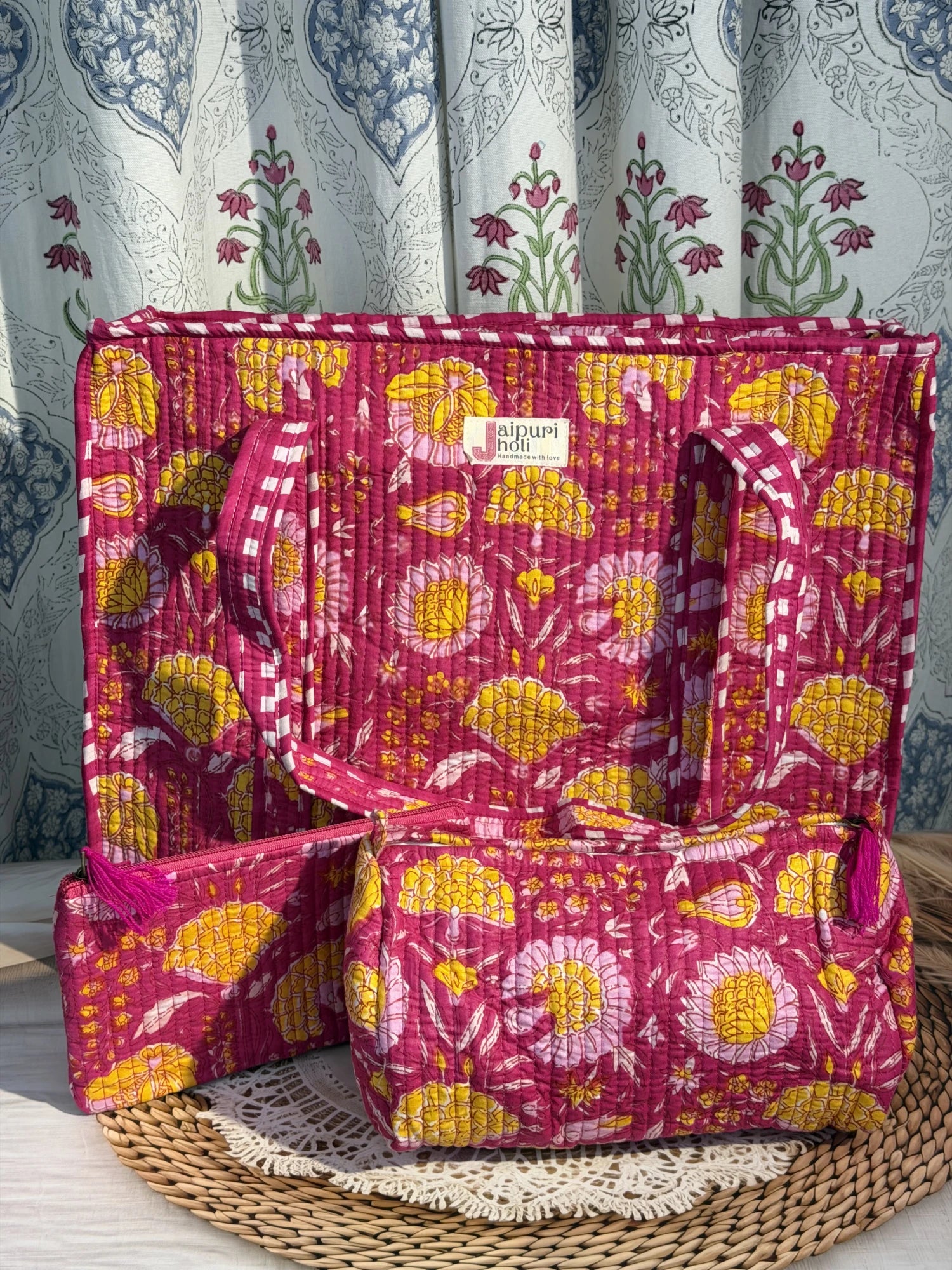 Jaipur block print cotton quilted large zip tote bag with matching toiletry pouch and flat pouch, pink floral print, 18 × 18 × 6 inch tote, 10 × 6 inch toiletry pouch and 9 × 7 inch flat pouch back view