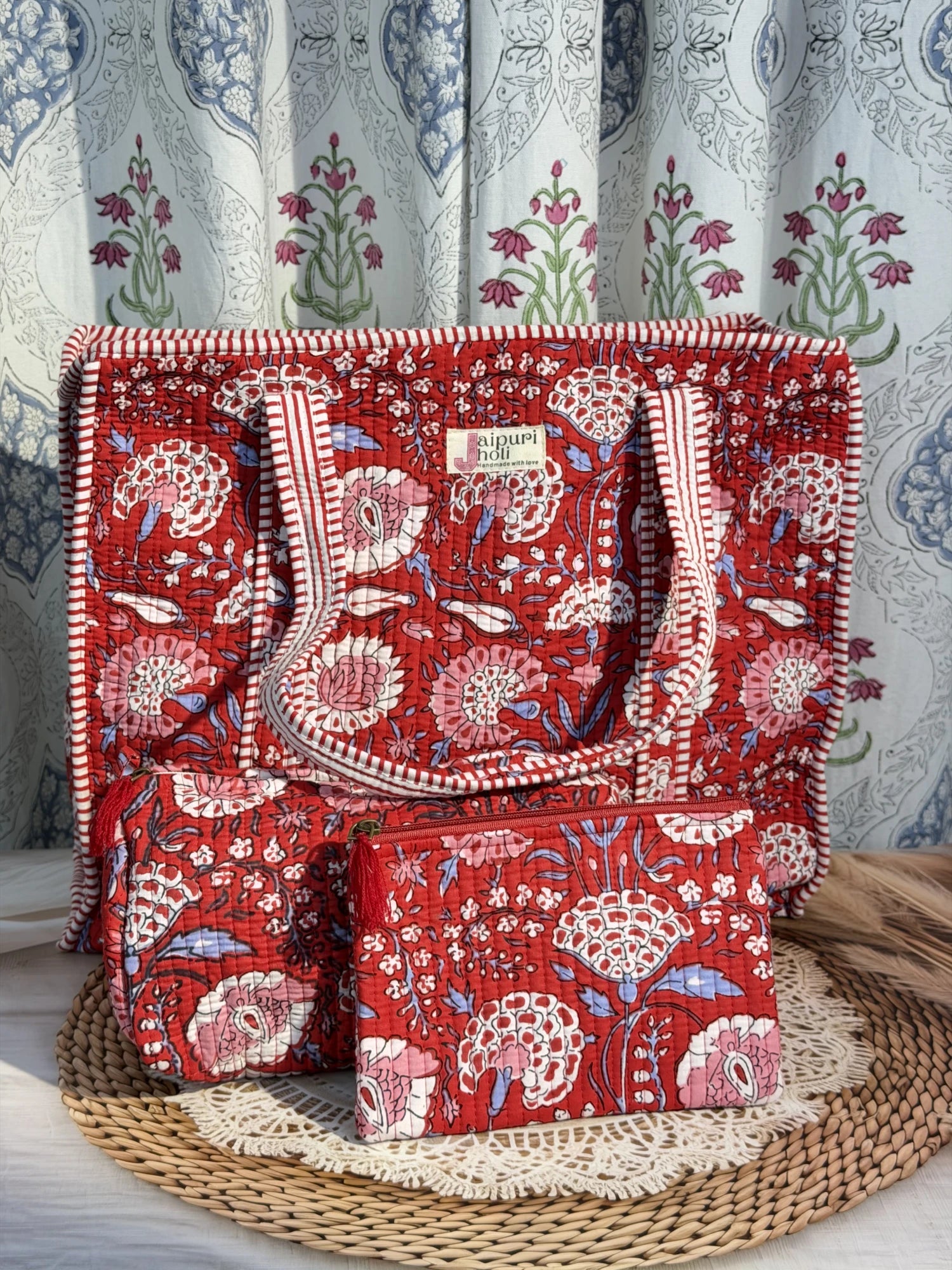 Jaipur block print cotton quilted large zip tote bag with matching toiletry pouch and flat pouch, red floral print, 18 × 18 × 6 inch tote, 10 × 6 inch toiletry pouch and 9 × 7 inch flat pouch front view