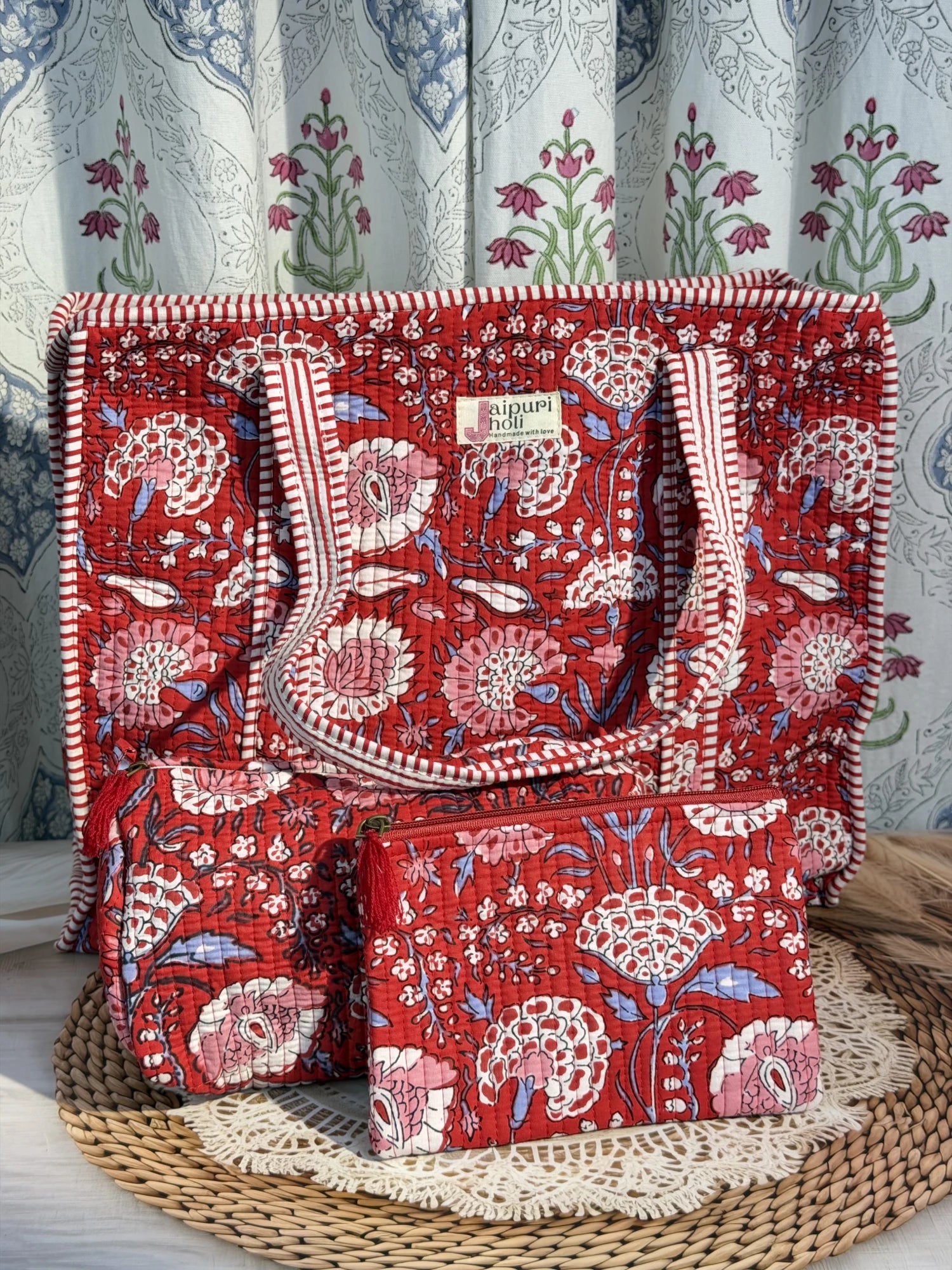 Jaipur block print cotton quilted large zip tote bag with matching toiletry pouch and flat pouch, red floral print, 18 × 18 × 6 inch tote, 10 × 6 inch toiletry pouch and 9 × 7 inch flat pouch side view