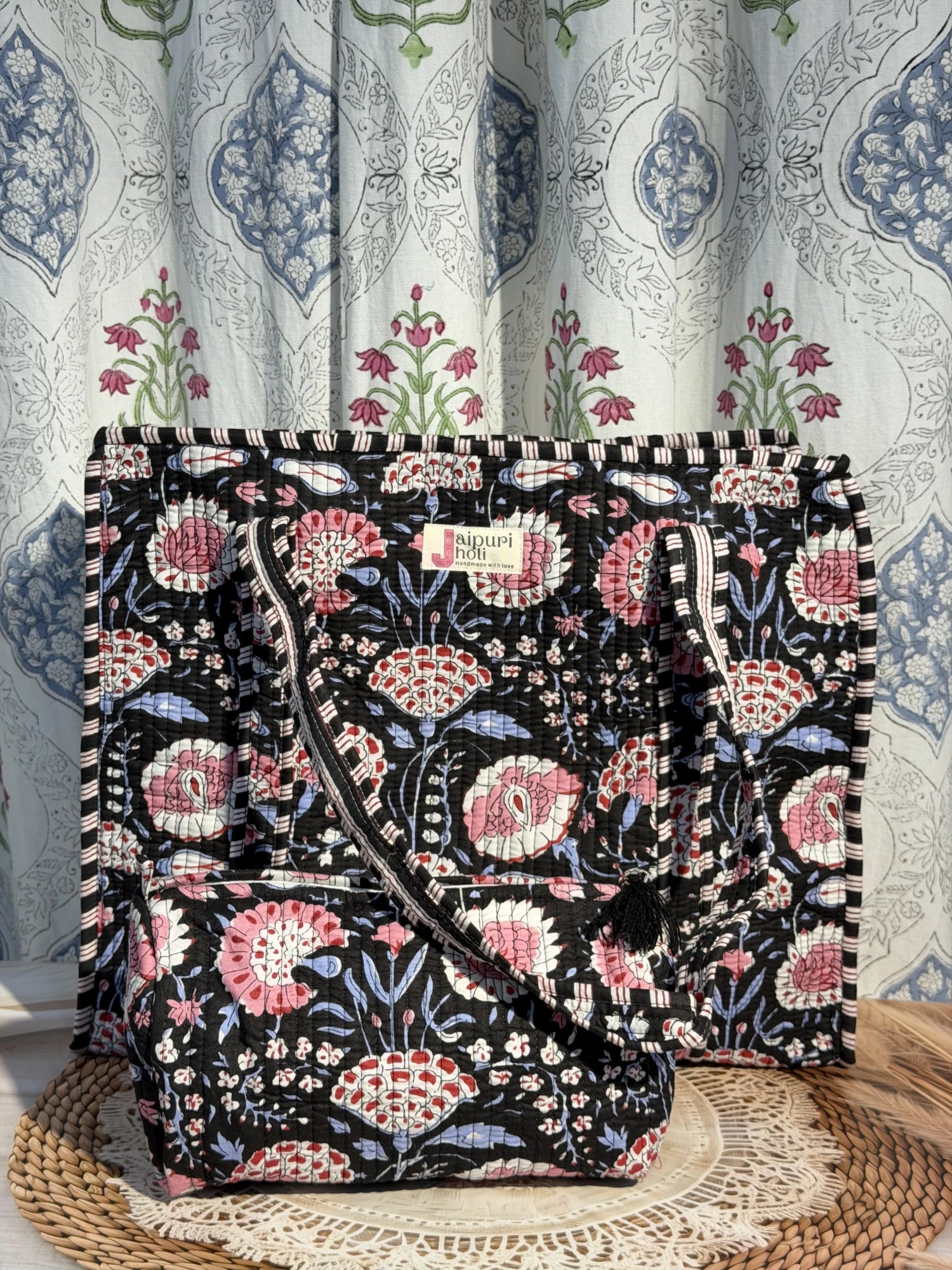 Jaipur block print cotton quilted large tote bag with matching pouch, black and pink floral print, 18x18x6 inch tote with 10x6 inch pouch for organizing cosmetics, toiletries and small travel items side view