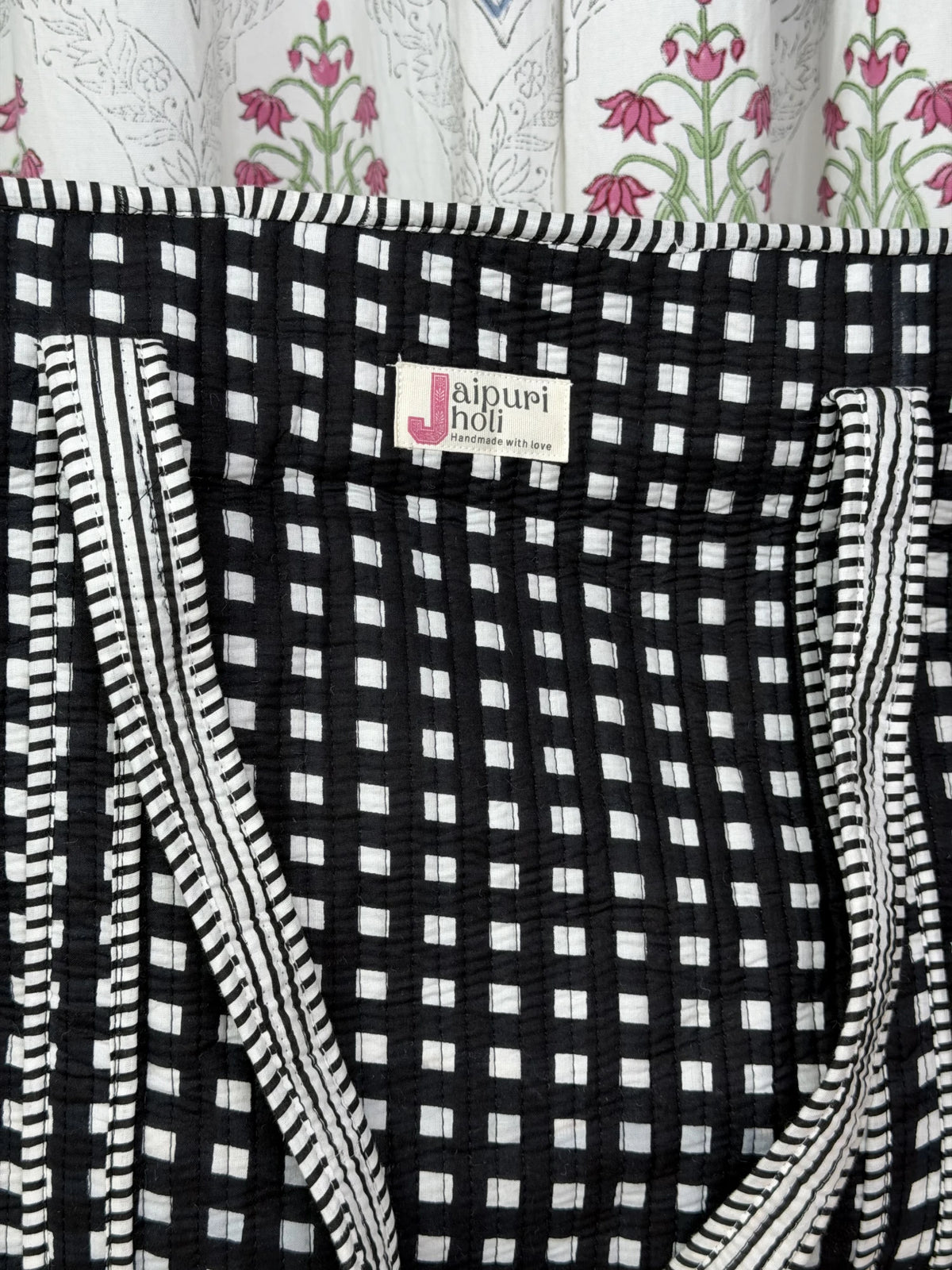Jaipur block print cotton quilted large tote bag with matching pouch, black and white geometric check print, 18x18x6 inch tote with 10x6 inch pouch for organizing toiletries, cosmetics and medicines, perfect for travel essentials close-up view