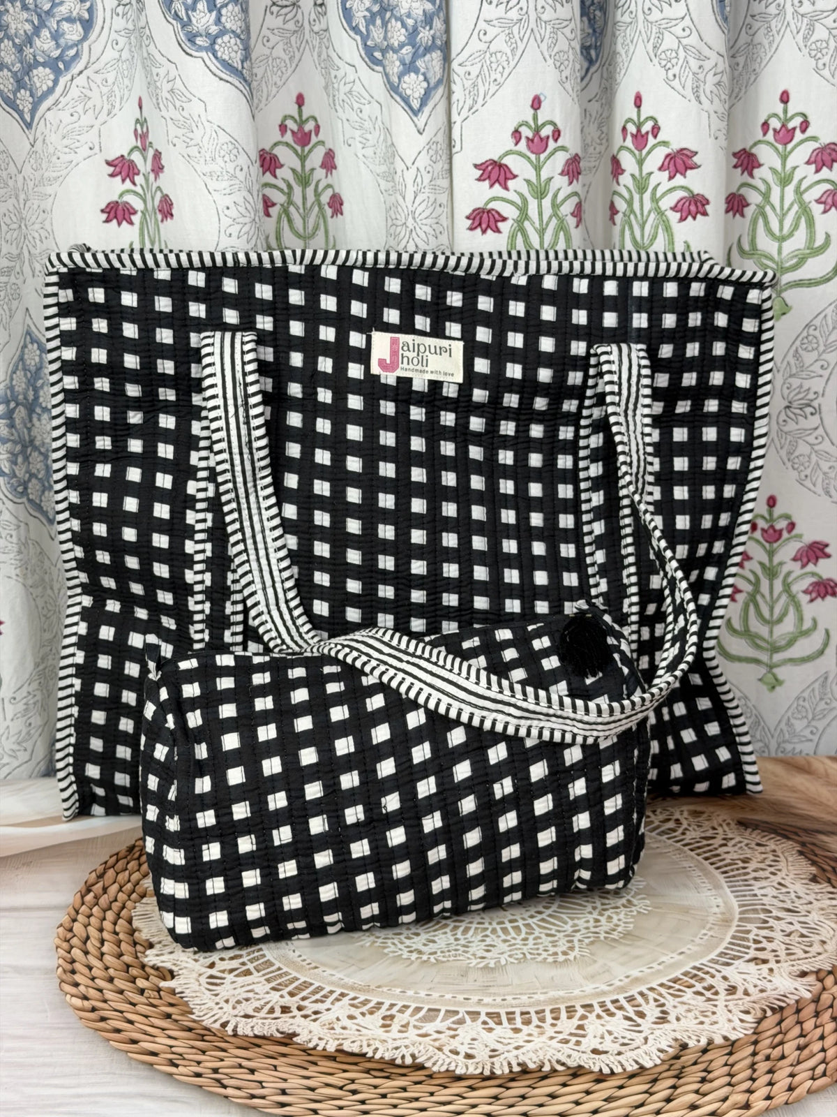 Jaipur block print cotton quilted large tote bag with matching pouch, black and pink floral print, 18x18x6 inch tote with 10x6 inch pouch for organizing cosmetics, toiletries and small travel items back view