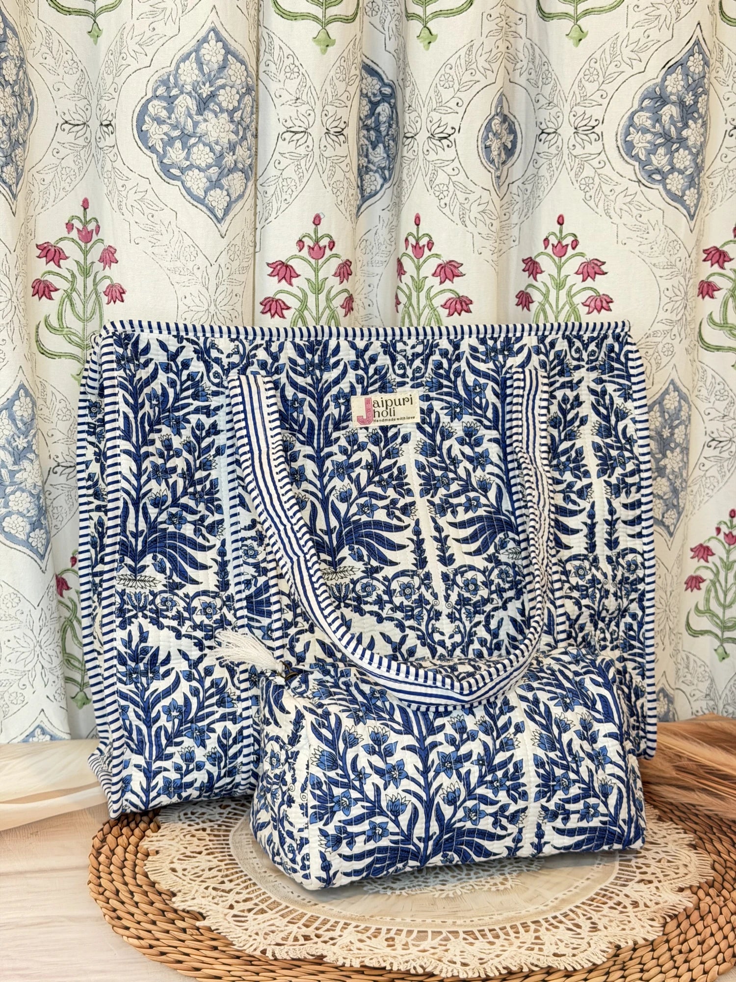 Jaipur block print cotton quilted large tote bag with matching pouch, blue floral and leaf print, 18x18x6 inch tote with 10x6 inch pouch for keeping cosmetics, medicines and toiletries organized front view
