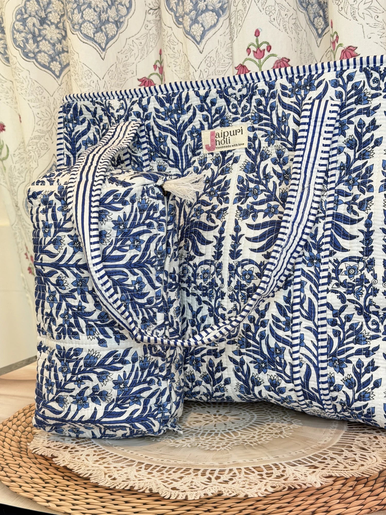 Jaipur block print cotton quilted large tote bag with matching pouch, blue floral and leaf print, 18x18x6 inch tote with 10x6 inch pouch for keeping cosmetics, medicines and toiletries organized side view