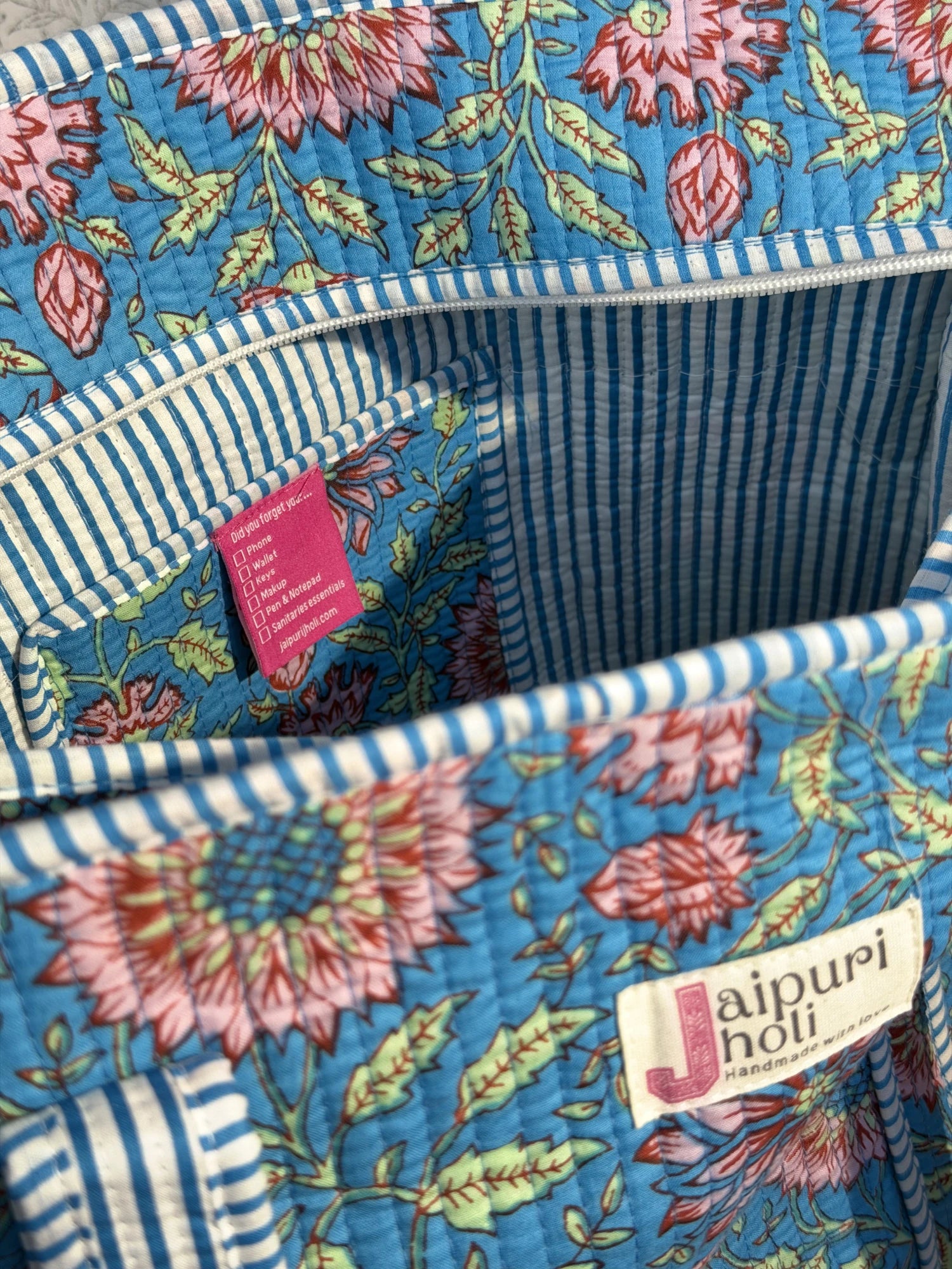 Jaipur block print cotton quilted large tote bag with matching pouch, blue floral print, 18x18x6 inch tote with 10x6 inch pouch for storing toiletries, cosmetics and daily travel essentials interior view
