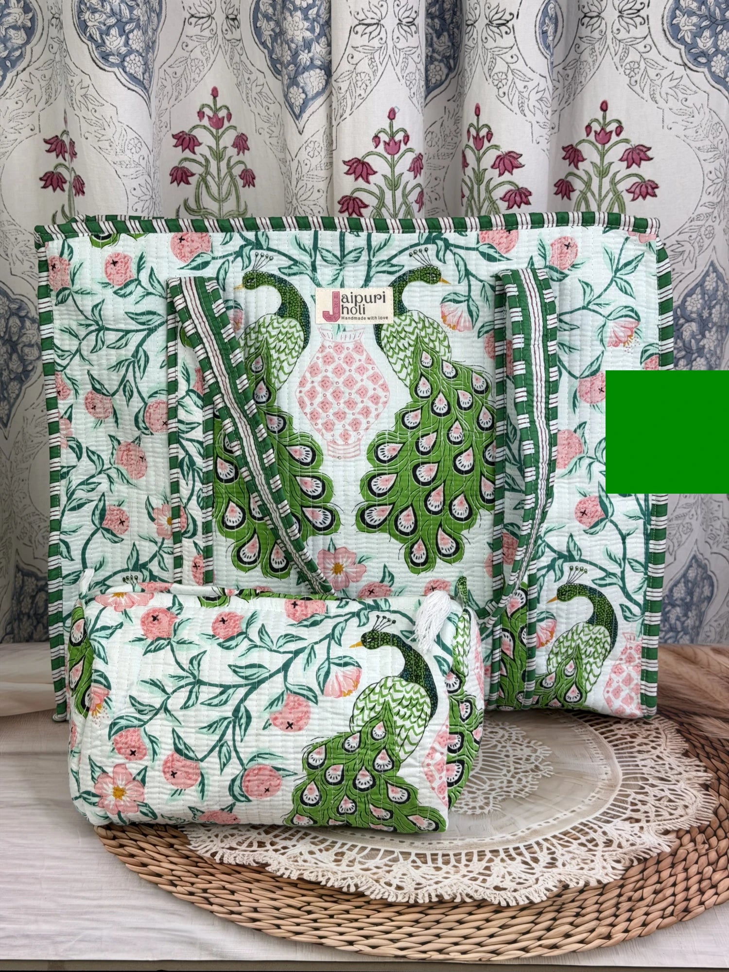 Jaipur block print cotton quilted large tote bag with matching pouch, green and pink peacock print, 18x18x6 inch tote with 10x6 inch pouch for organizing toiletries and other travel essentials side view