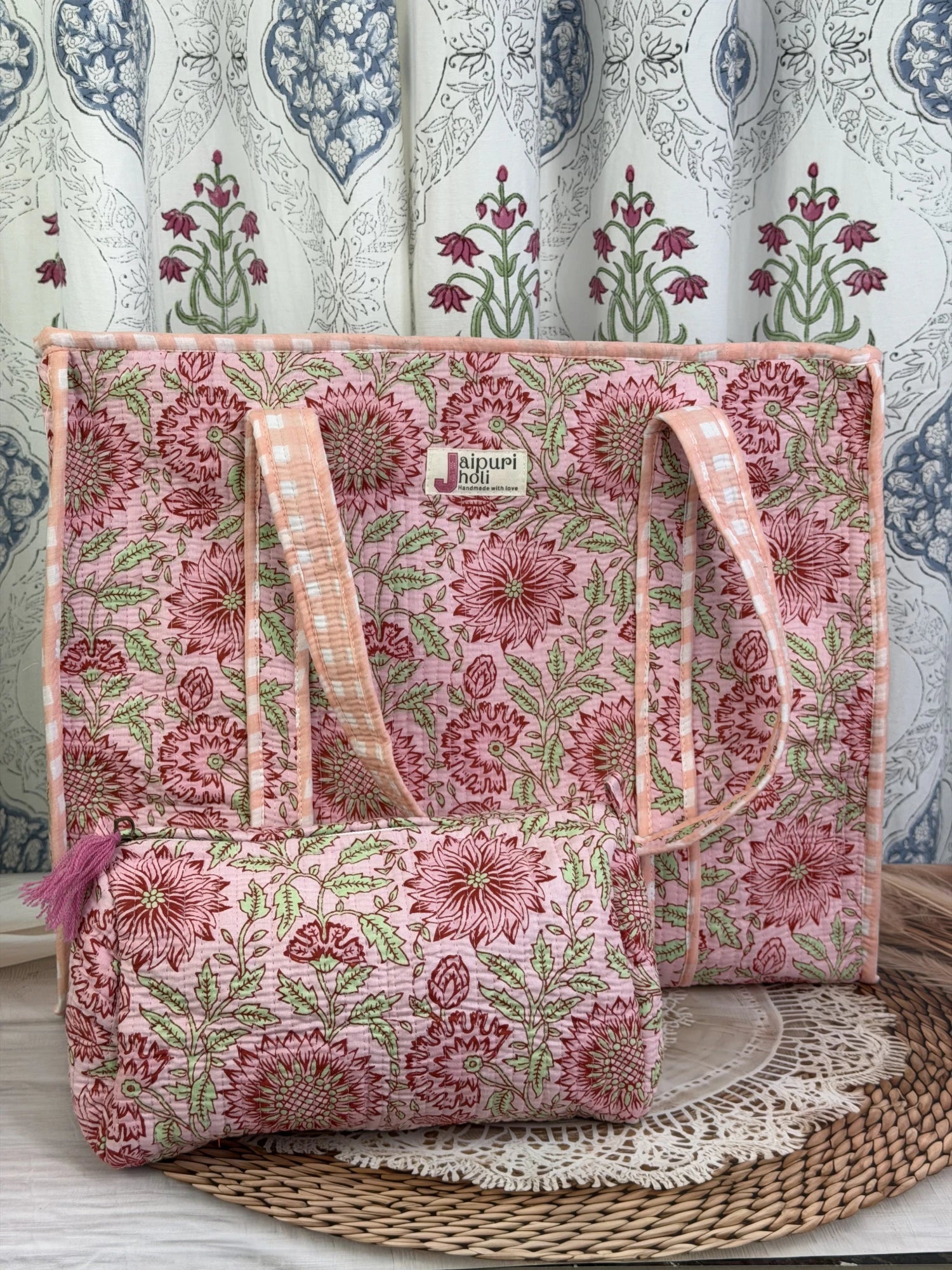 Jaipur block print cotton quilted large tote bag with matching pouch, peach and pink floral print, 18x18x6 inch tote with 10x6 inch pouch for keeping toiletries and cosmetics in one place front view