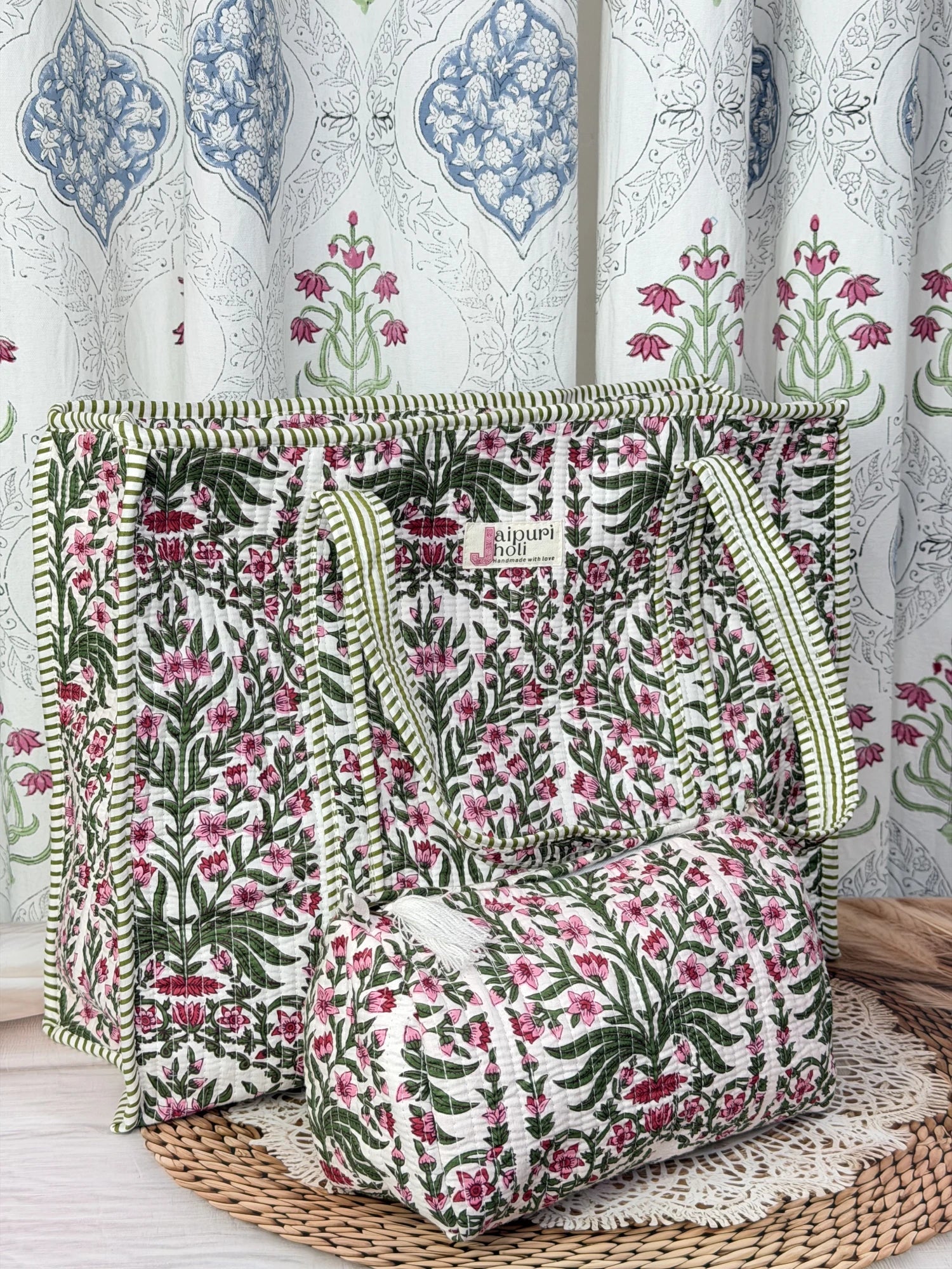 Jaipur block print cotton quilted large tote bag with matching pouch, pink floral and green leaf print, 18x18x6 inch tote with 10x6 inch pouch for storing toiletries and everyday travel items close-up view 