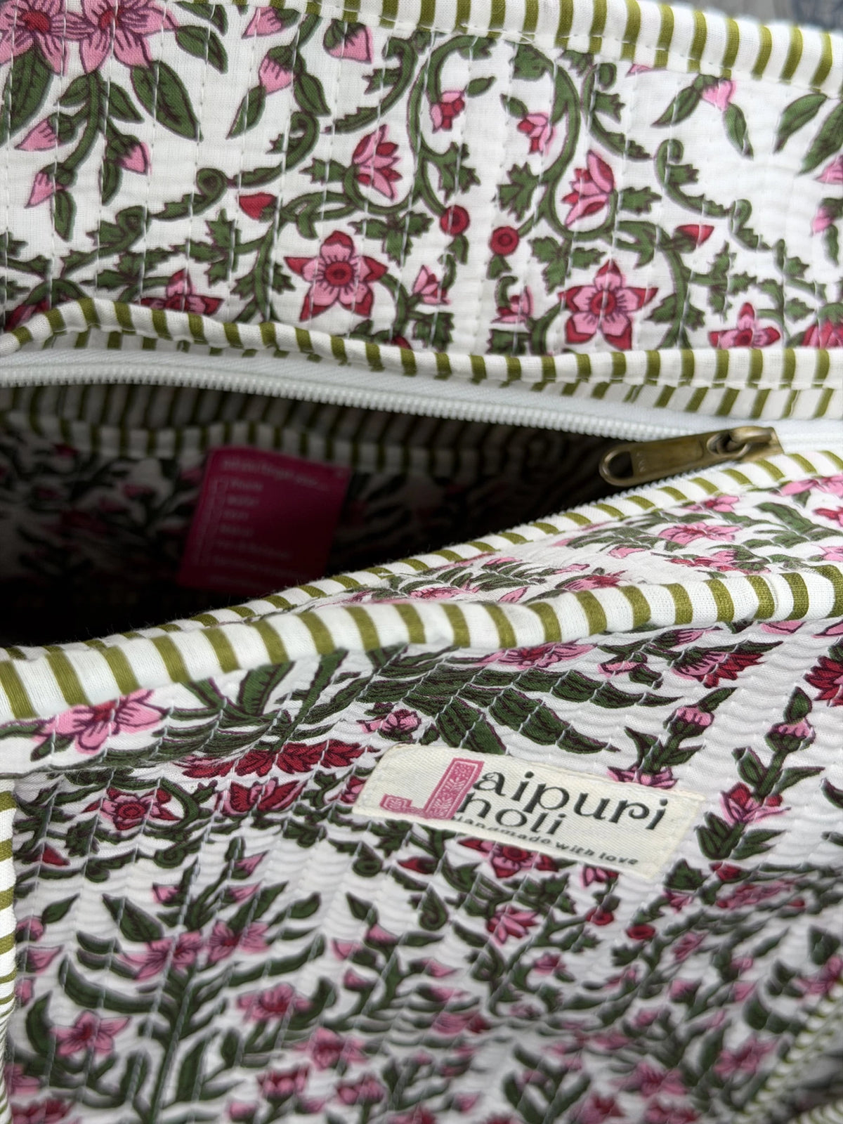 Jaipur block print cotton quilted large tote bag with matching pouch, pink floral and green leaf print, 18x18x6 inch tote with 10x6 inch pouch for storing toiletries and everyday travel items close-up view