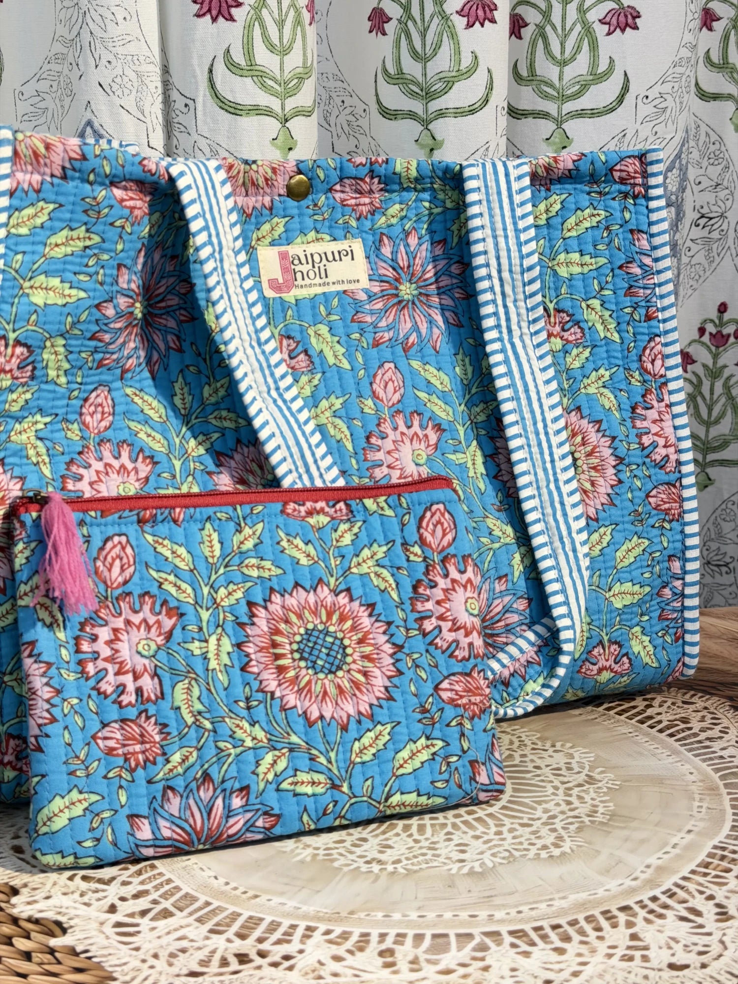 Jaipur block print cotton quilted medium reversible tote bag with matching flat pouch, blue floral print, 15 × 12 × 6 inch tote and 9 × 7 inch flat pouch for office, travel and everyday use side view