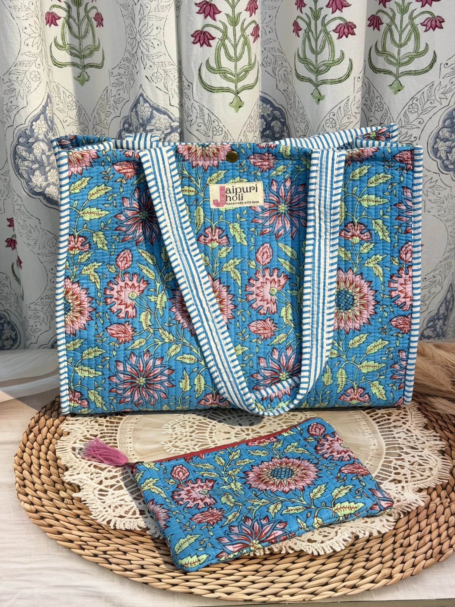 Jaipur block print cotton quilted medium reversible tote bag with matching flat pouch, blue floral print, 15 × 12 × 6 inch tote and 9 × 7 inch flat pouch for office, travel and everyday use close-up view