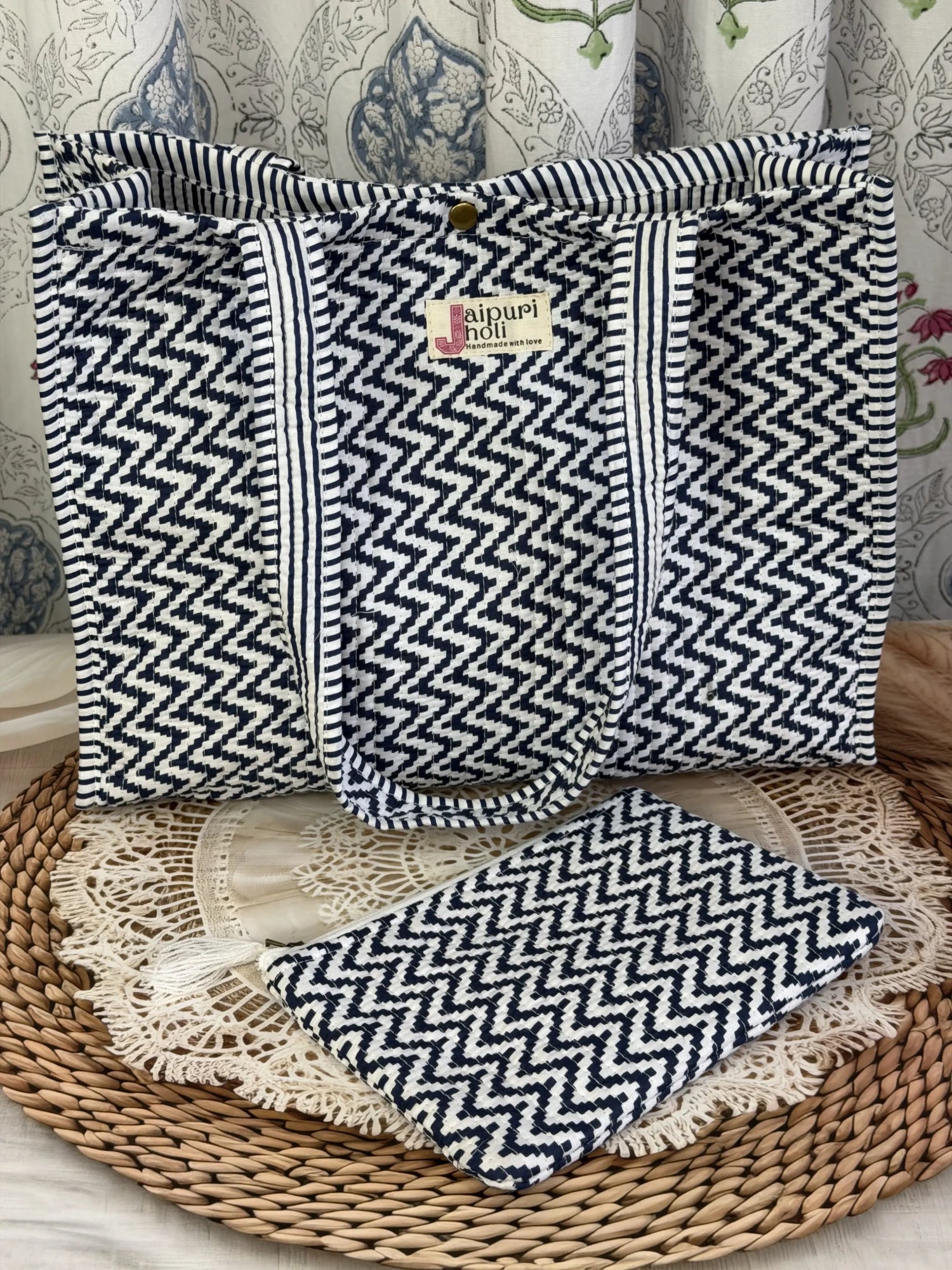 Jaipur block print cotton quilted medium reversible tote bag with matching flat pouch, blue and white geometric zigzag print, 15 × 12 × 6 inch tote and 9 × 7 inch flat pouch for travel, office and everyday use close-up view