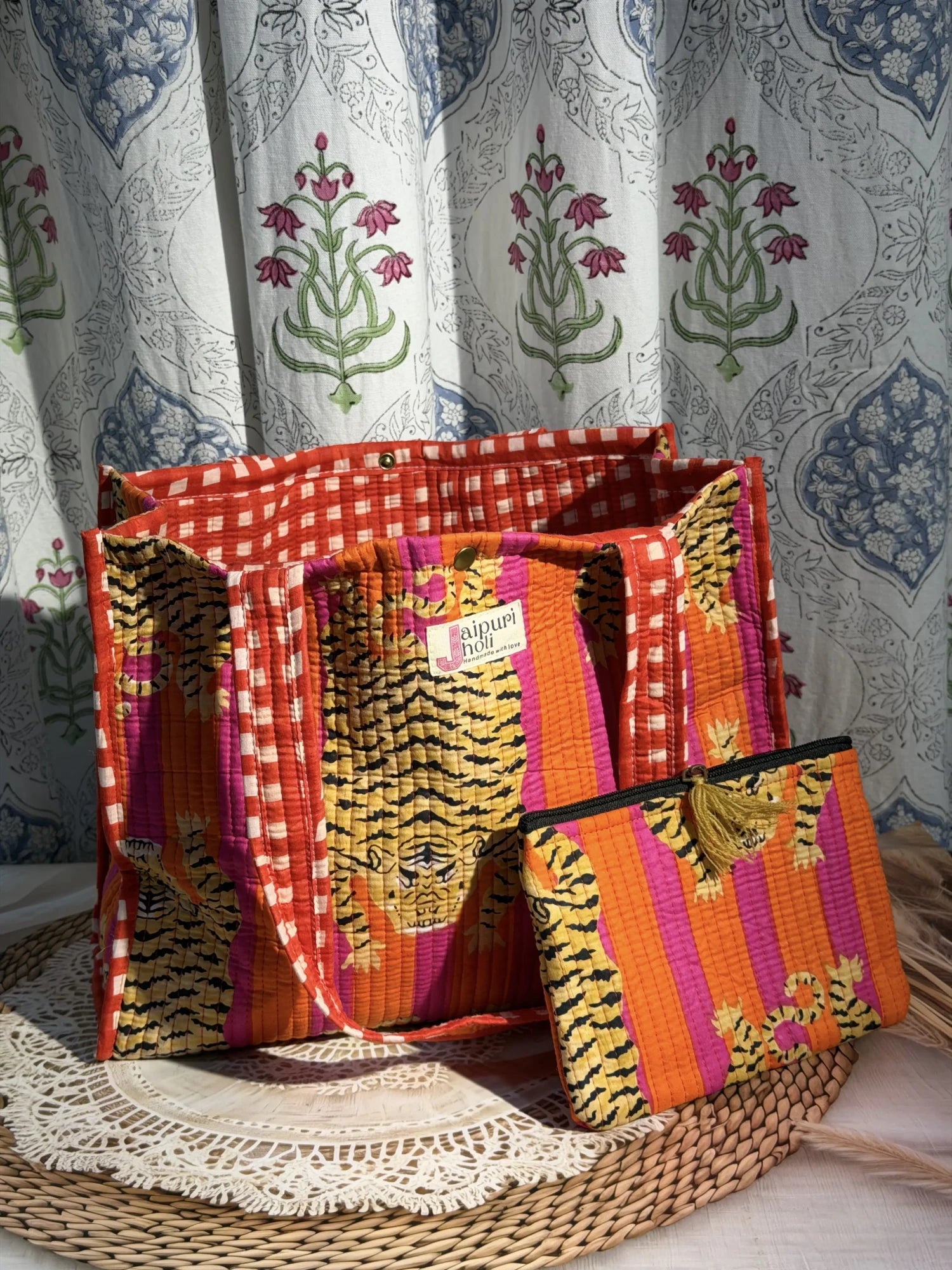 Jaipur block print cotton quilted medium reversible tote bag with matching flat pouch, orange and pink tiger animal print, 15 × 12 × 6 inch tote and 9 × 7 inch flat pouch for office, travel and daily use. front view