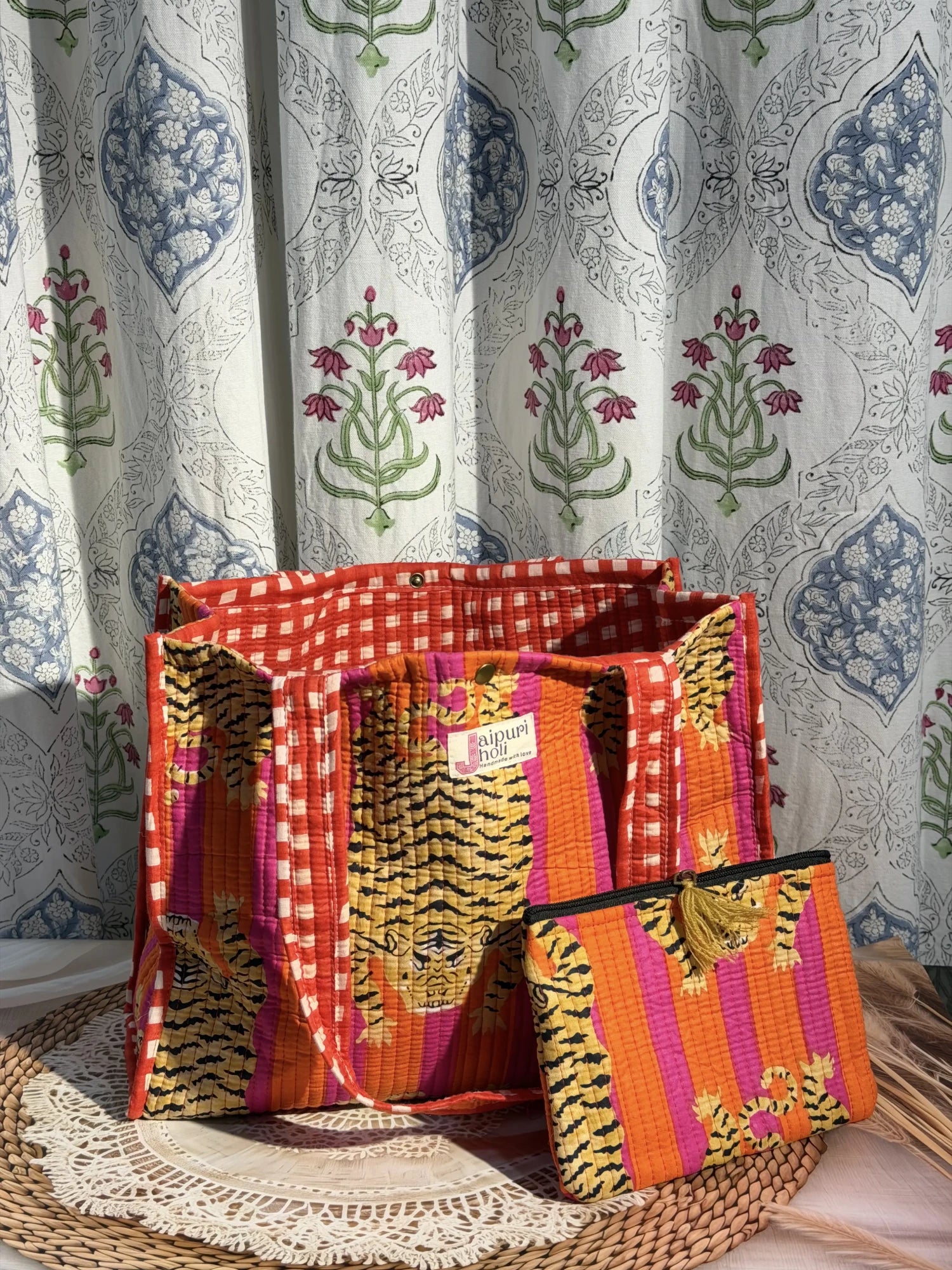 Jaipur block print cotton quilted medium reversible tote bag with matching flat pouch, orange and pink tiger animal print, 15 × 12 × 6 inch tote and 9 × 7 inch flat pouch for office, travel and daily use side view
