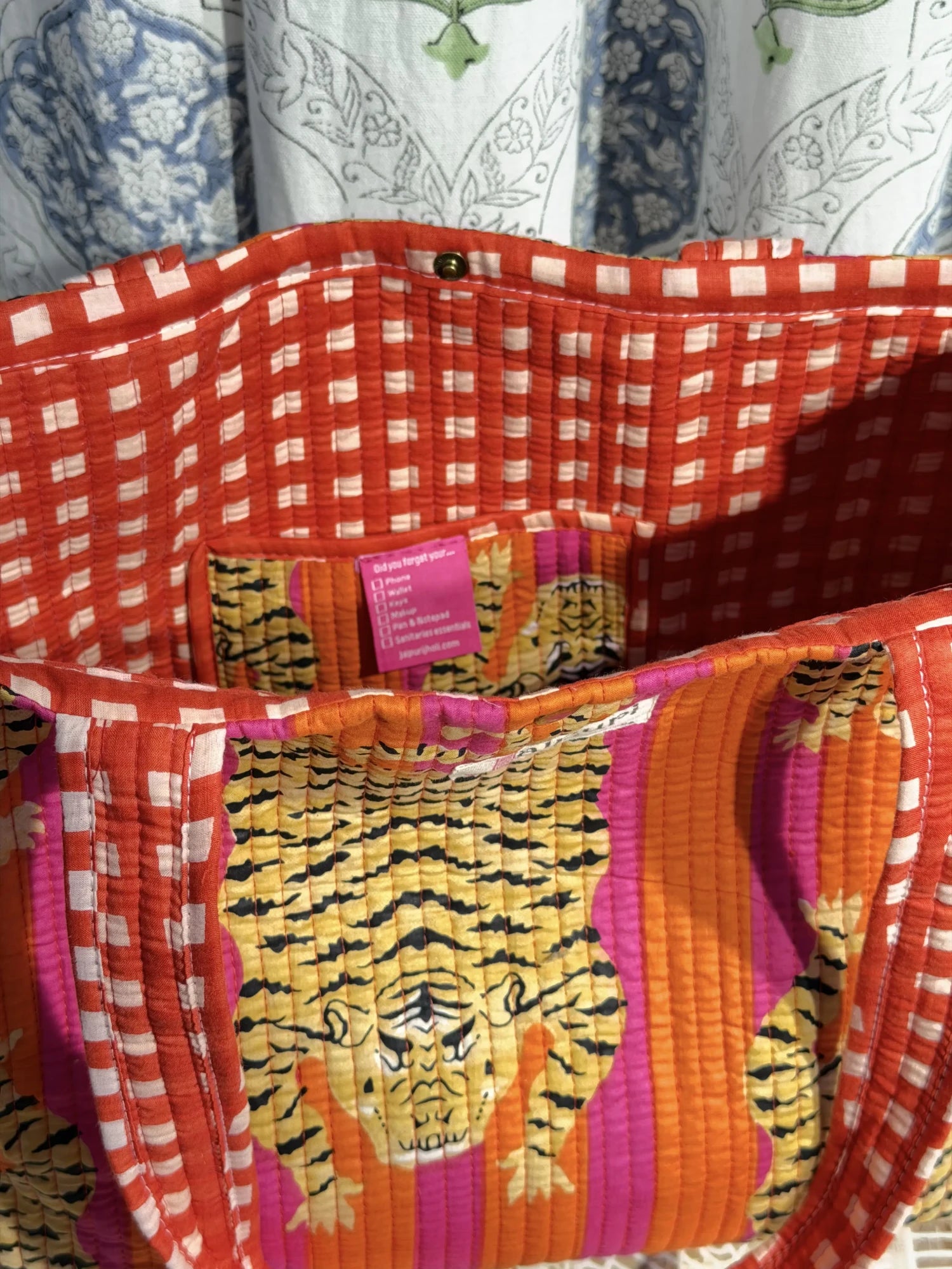 Jaipur block print cotton quilted medium reversible tote bag with matching flat pouch, orange and pink tiger animal print, 15 × 12 × 6 inch tote and 9 × 7 inch flat pouch for office, travel and daily use interior view