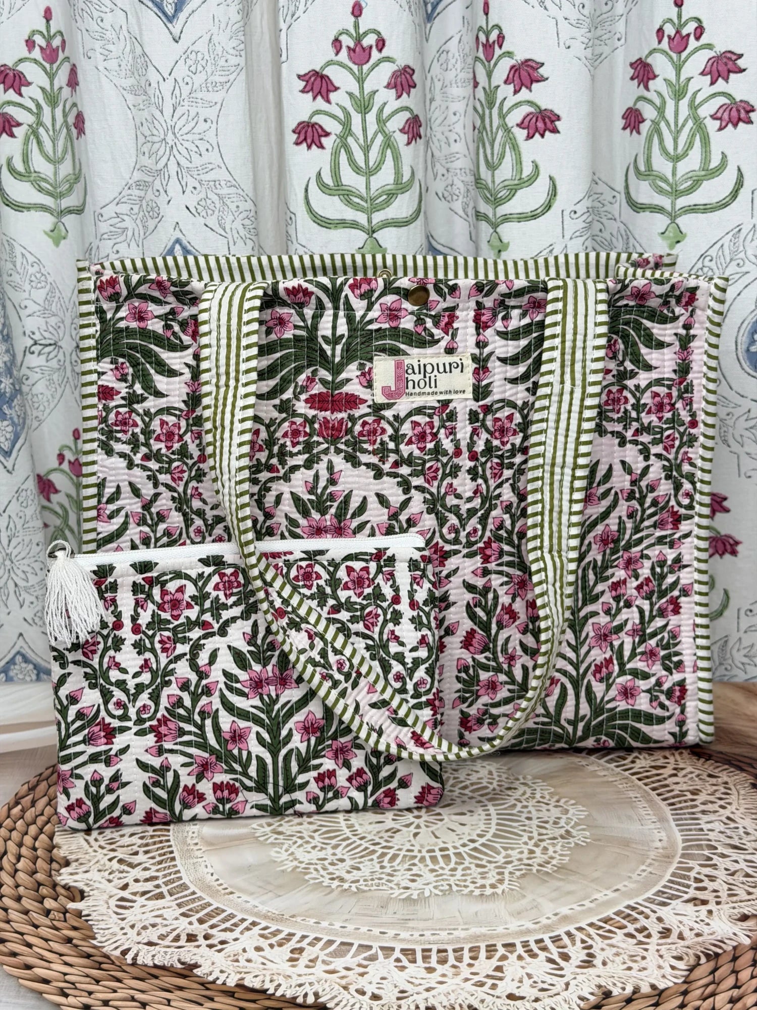 Jaipur block print cotton quilted medium reversible tote bag with matching flat pouch, pink floral and green leaf print, 15 × 12 × 6 inch tote and 9 × 7 inch flat pouch for travel, shopping and work front view