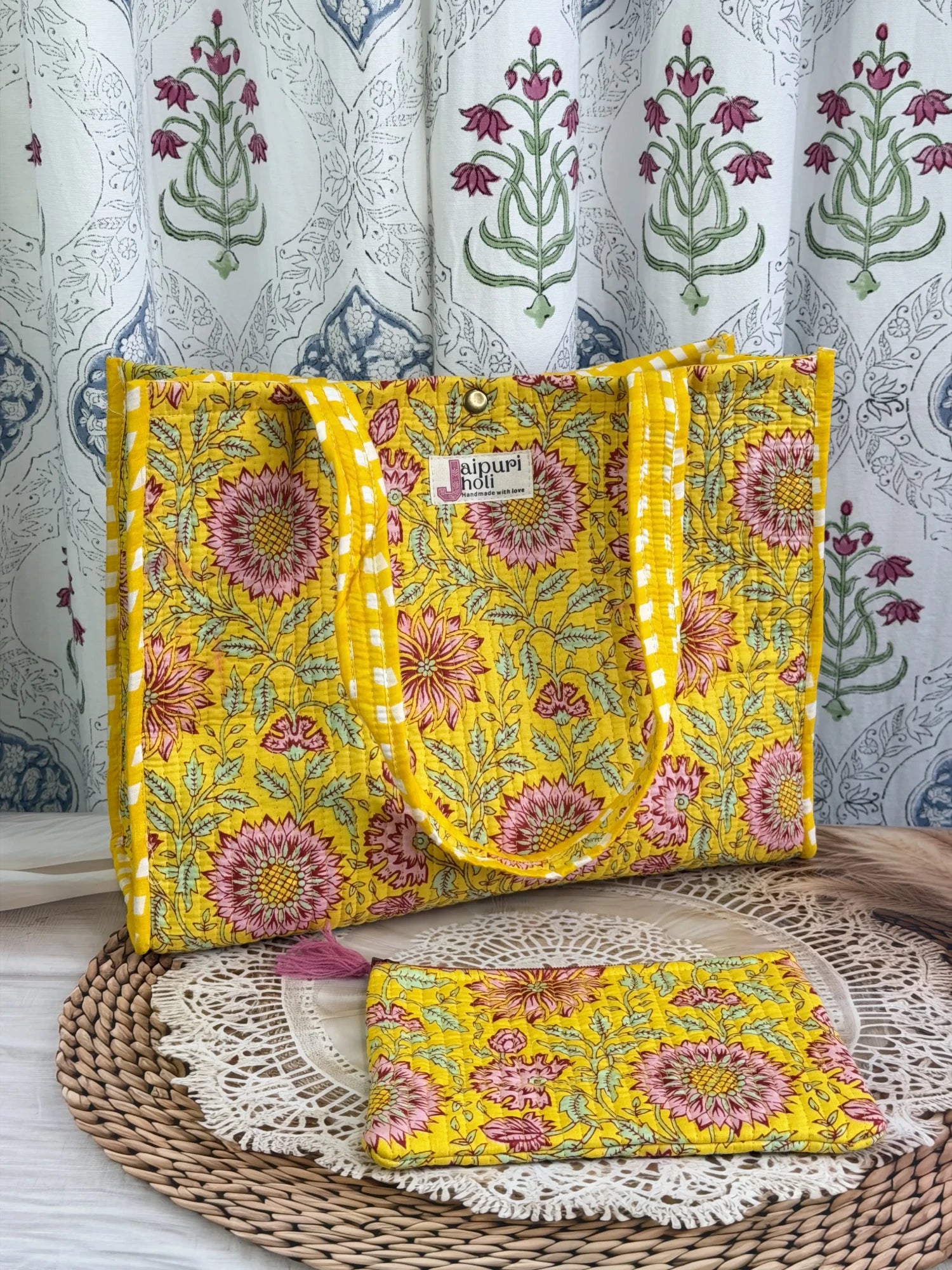 Jaipur block print cotton quilted medium reversible tote bag with matching flat pouch, yellow floral print, 15 × 12 × 6 inch tote and 9 × 7 inch flat pouch for daily use, travel and shopping side view