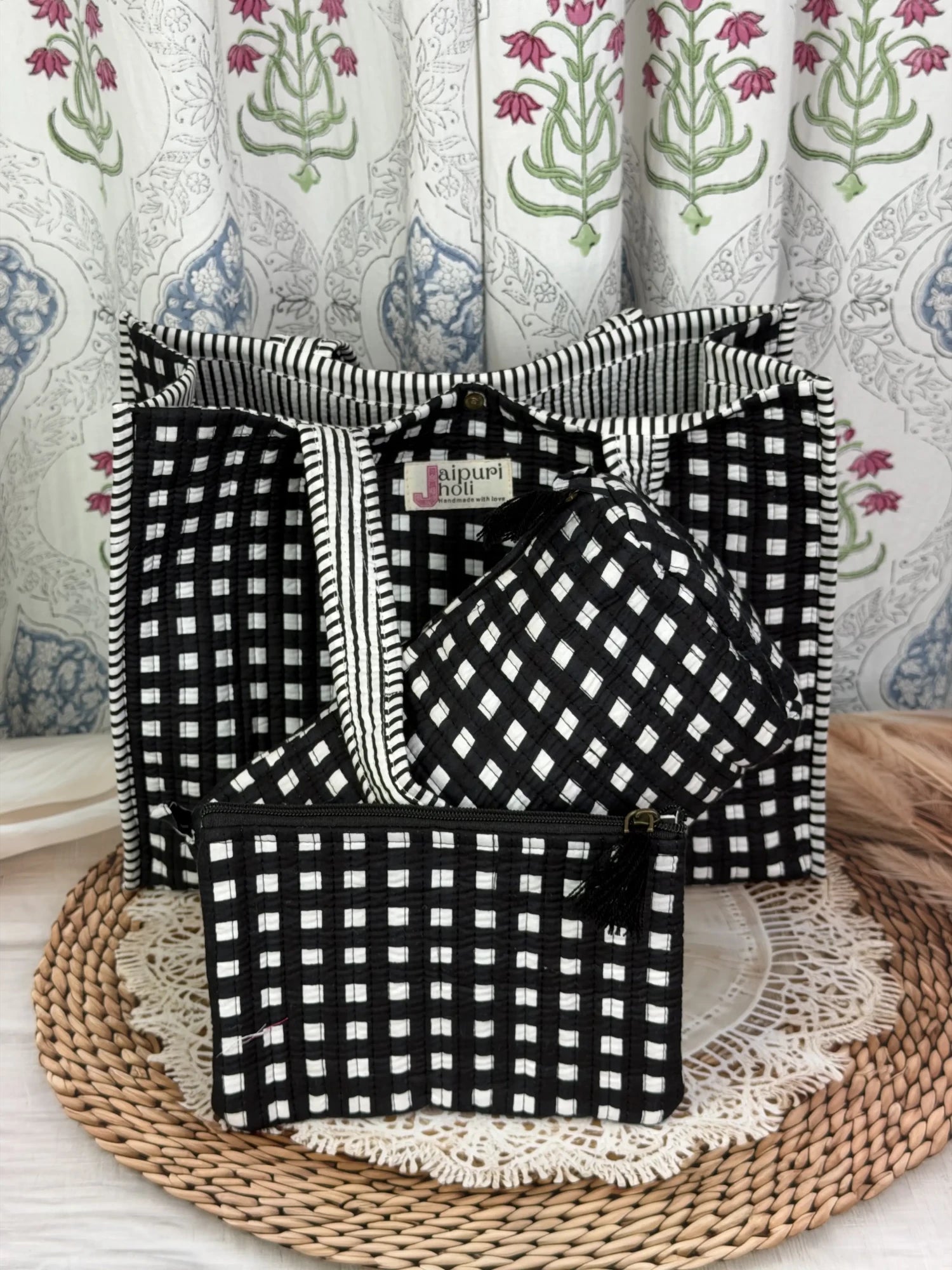 Jaipur block print medium cotton quilted reversible tote bag with matching toiletry pouch and flat pouch, black and white geometric check print, 15 × 12 × 6 inch tote with button closure, 10 × 6 inch toiletry pouch and 9 × 7 inch flat pouch back view