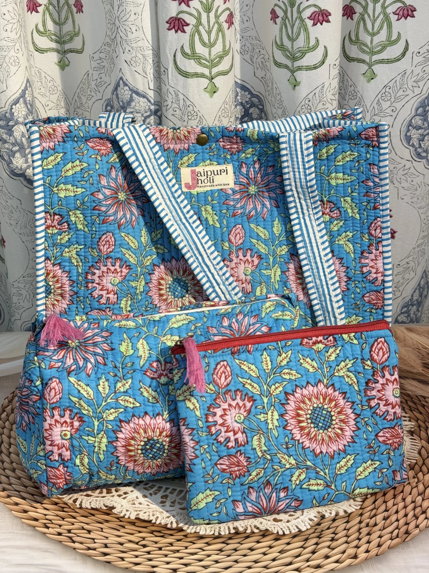 Jaipur block print medium cotton quilted reversible tote bag with matching toiletry pouch and flat pouch, blue floral print, 15 × 12 × 6 inch tote with button closure, 10 × 6 inch toiletry pouch and 9 × 7 inch flat pouch interior view