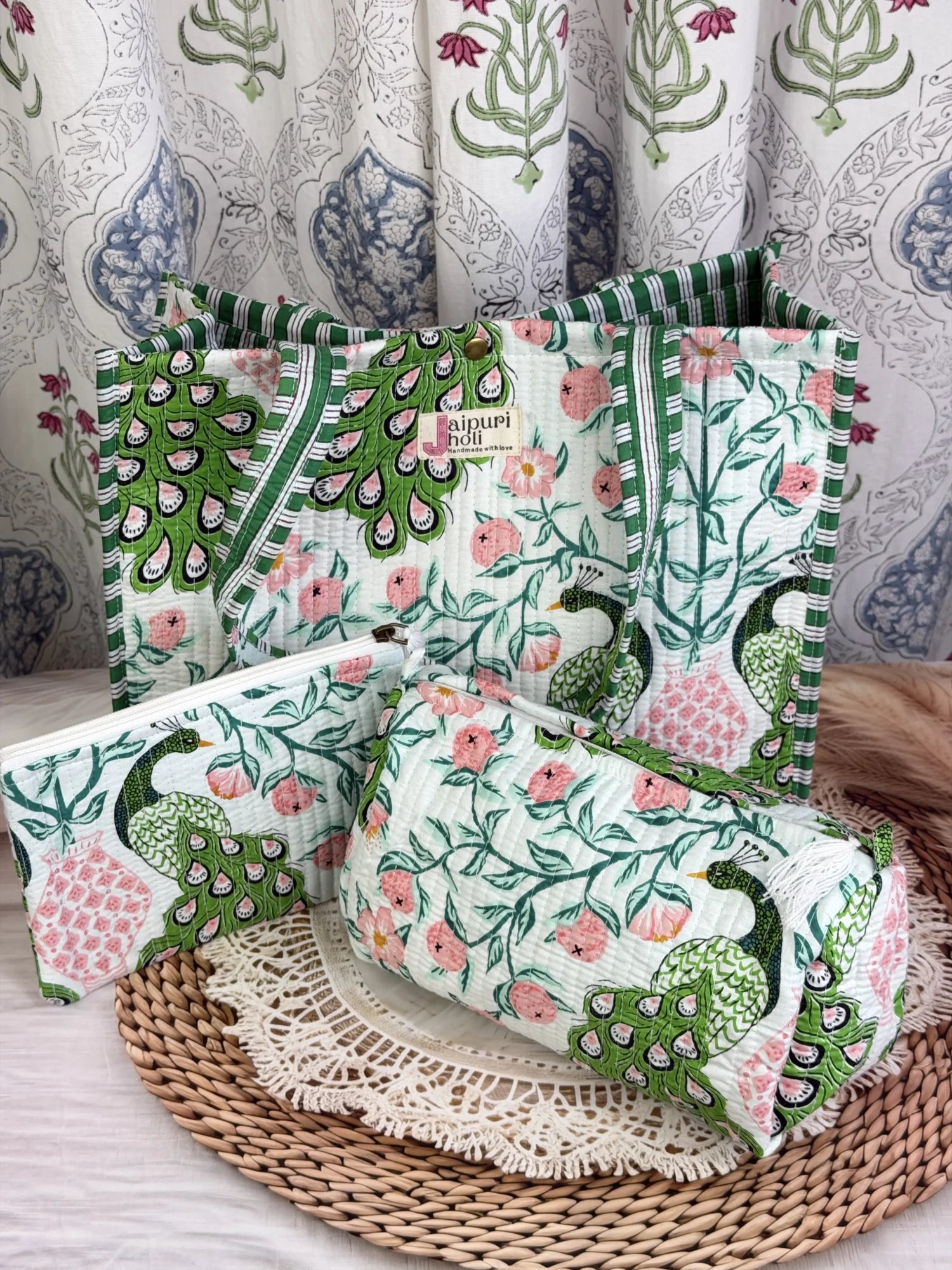 Jaipur block print medium cotton quilted reversible tote bag with matching toiletry pouch and flat pouch, green and pink peacock print, 15 × 12 × 6 inch tote with button closure, 10 × 6 inch toiletry pouch and 9 × 7 inch flat pouch back view
