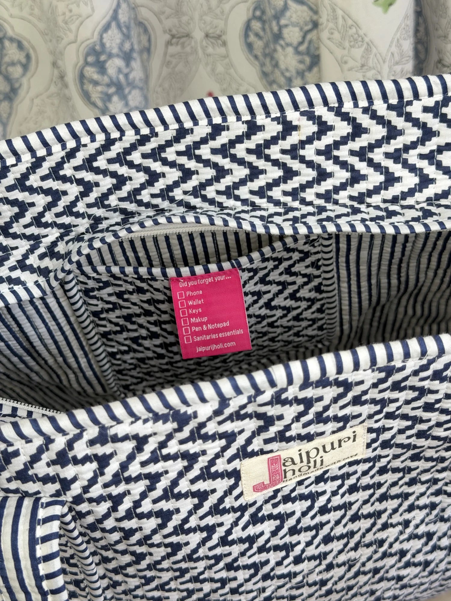 Jaipur block print cotton quilted medium zip tote bag with matching flat pouch, blue and white geometric zigzag print, 15 × 12 × 6 inch tote with 9 × 7 inch flat pouch for office, travel and daily use close-up view