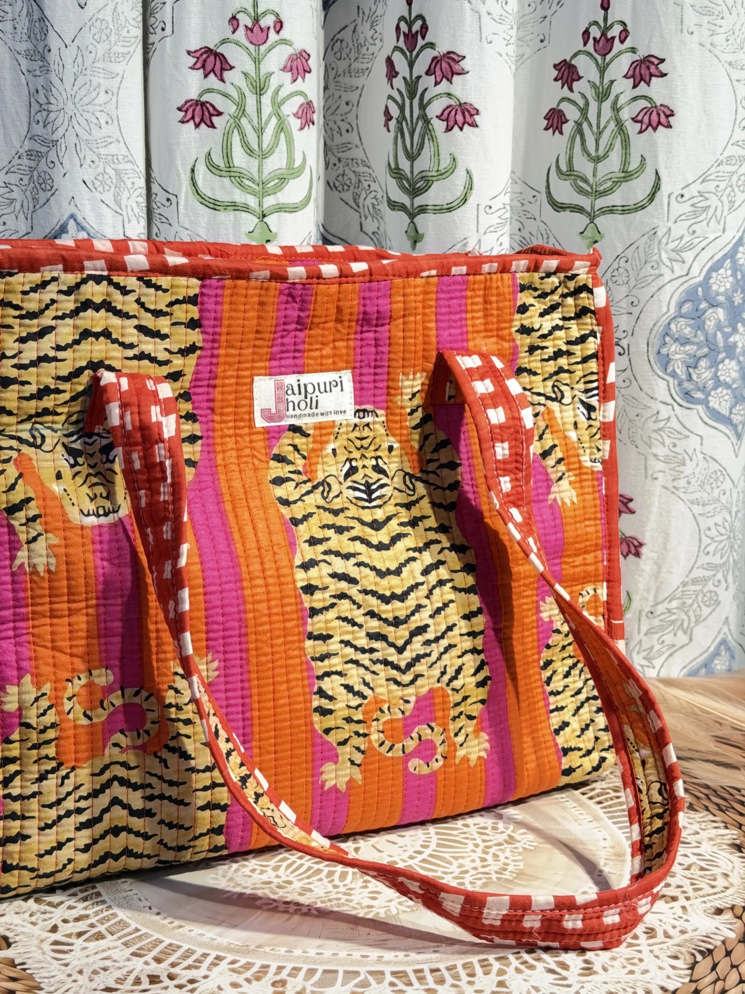 Jaipur block print cotton quilted medium zip tote bag with matching flat pouch, orange and pink tiger animal print, 15 × 12 × 6 inch tote with 9 × 7 inch flat pouch for office, travel and shopping side view