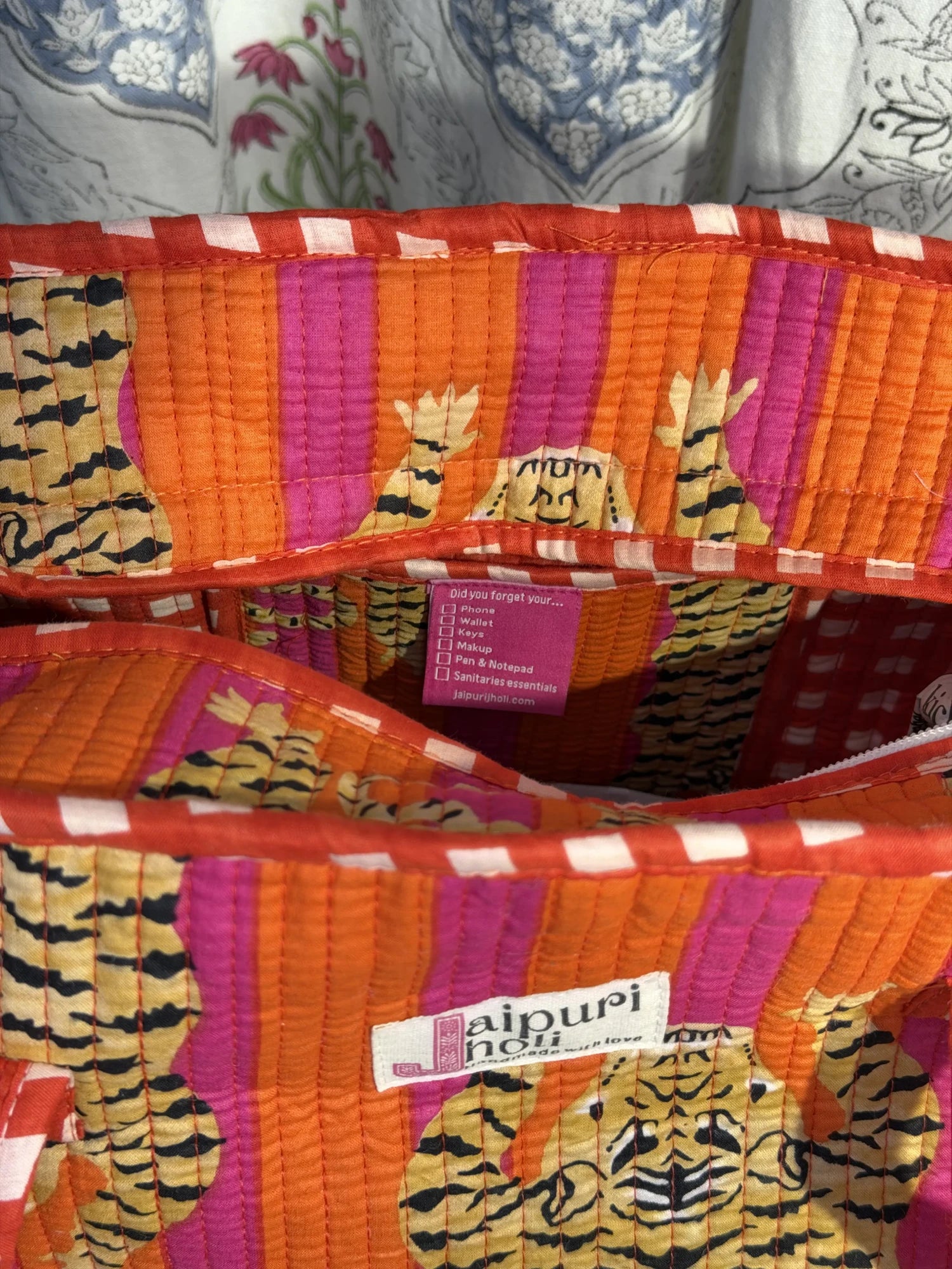 Jaipur block print cotton quilted medium zip tote bag with matching flat pouch, orange and pink tiger animal print, 15 × 12 × 6 inch tote with 9 × 7 inch flat pouch for office, travel and shopping interior view