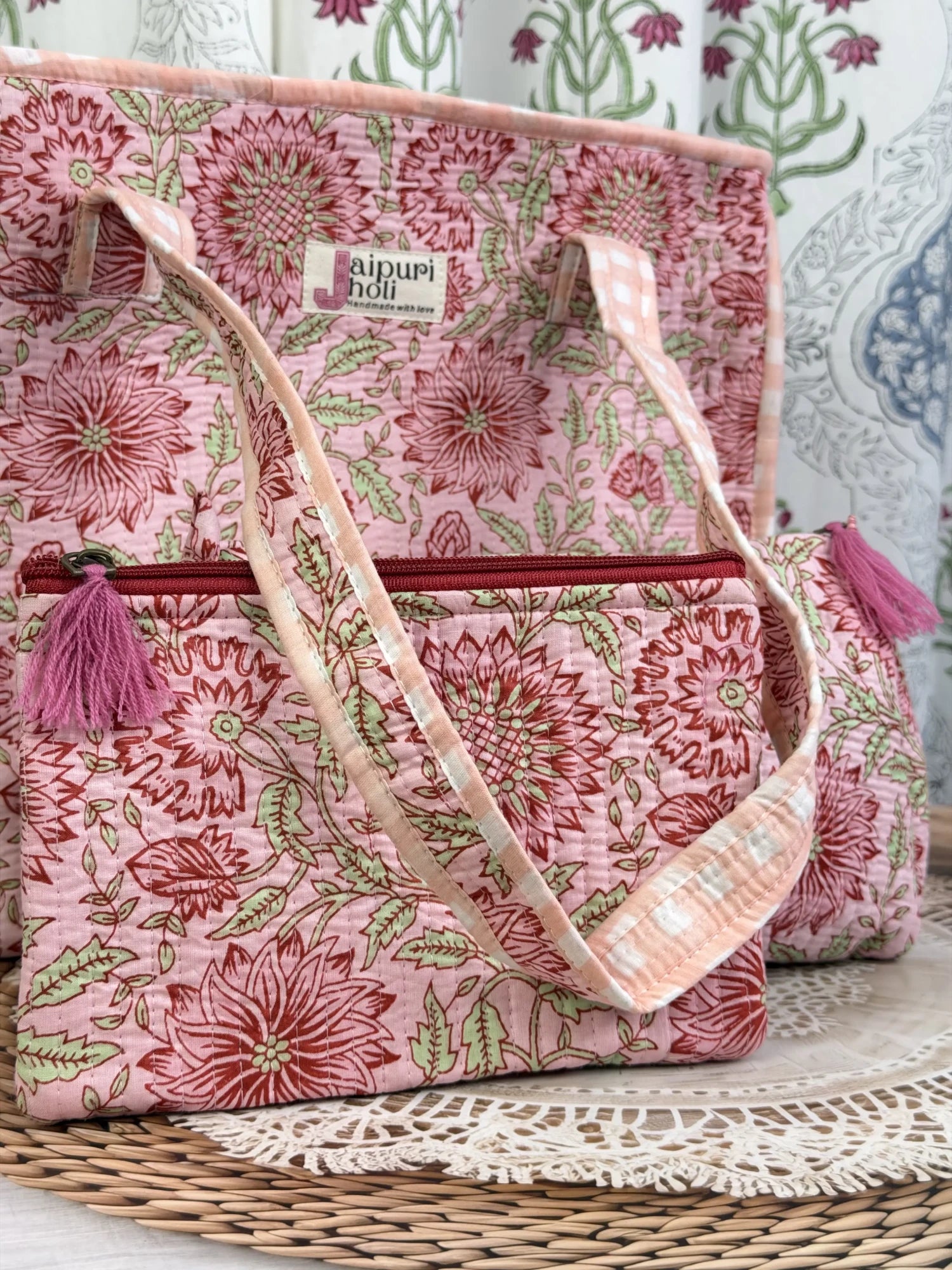 Jaipur block print cotton quilted medium zip tote bag with matching flat pouch, peach and pink floral print, 15 × 12 × 6 inch tote with 9 × 7 inch flat pouch for work, travel and daily use side view