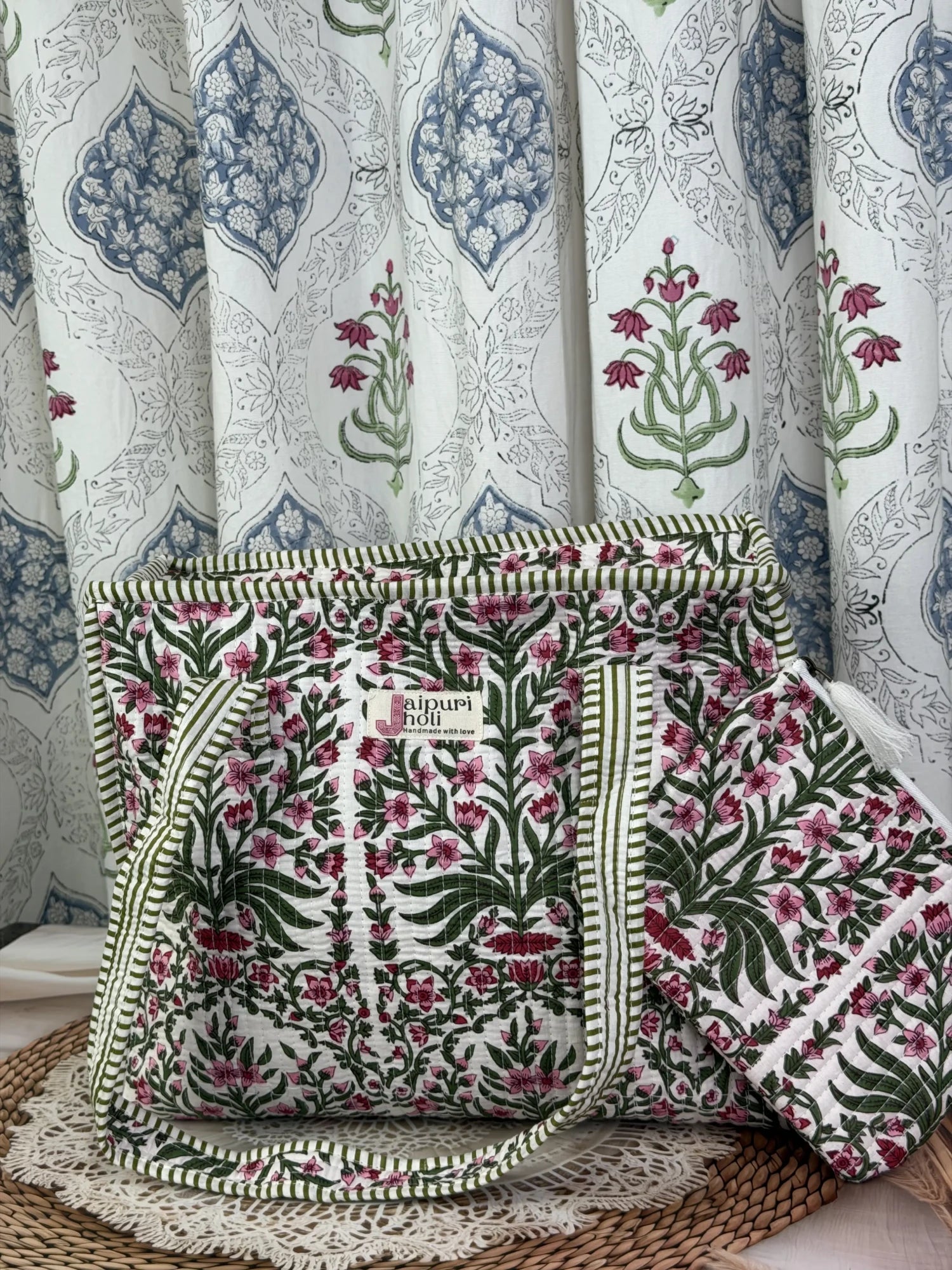 Jaipur block print cotton quilted medium zip tote bag with matching flat pouch, pink floral and green leaf print, 15 × 12 × 6 inch tote with 9 × 7 inch flat pouch for travel, office and daily use.Close-Up View