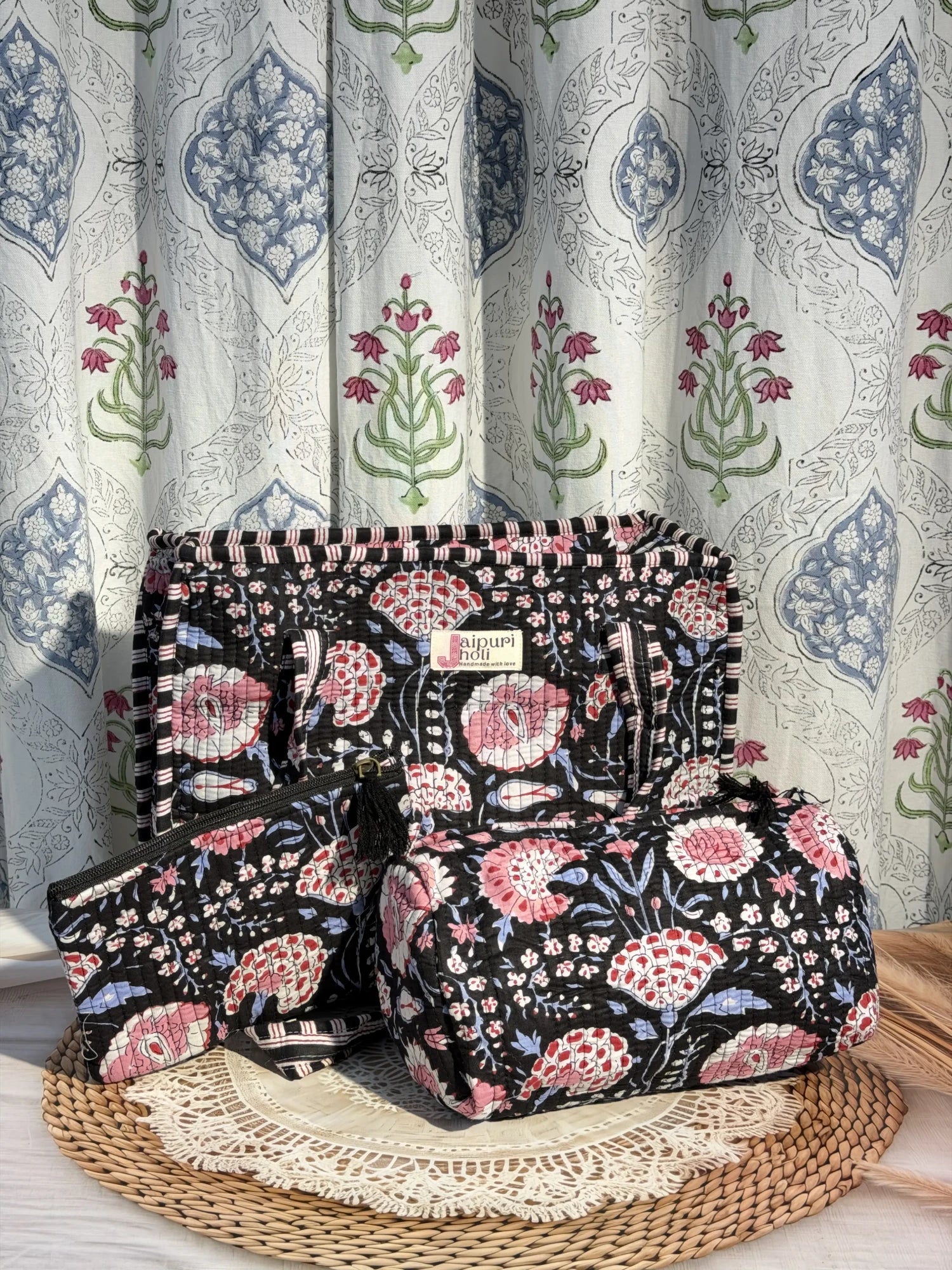 Jaipur block print medium cotton quilted zip tote bag with matching toiletry pouch and flat pouch, black and pink floral print, 15 × 12 × 6 inch tote, 10 × 6 inch toiletry pouch and 9 × 7 inch flat pouch back view