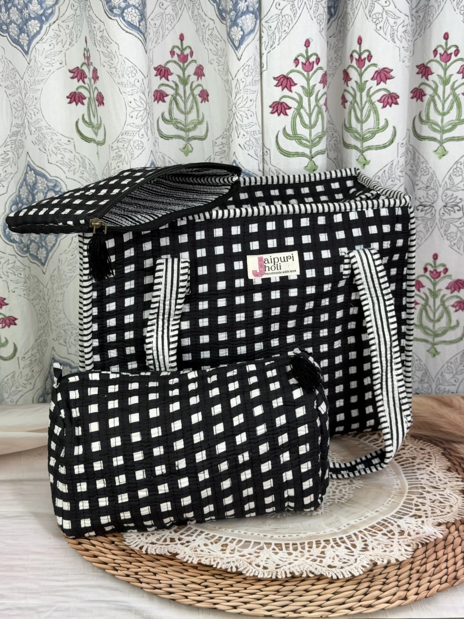 Jaipur block print medium cotton quilted zip tote bag with matching toiletry pouch and flat pouch, black and white geometric check print, 15 × 12 × 6 inch tote, 10 × 6 inch toiletry pouch and 9 × 7 inch flat pouch front view