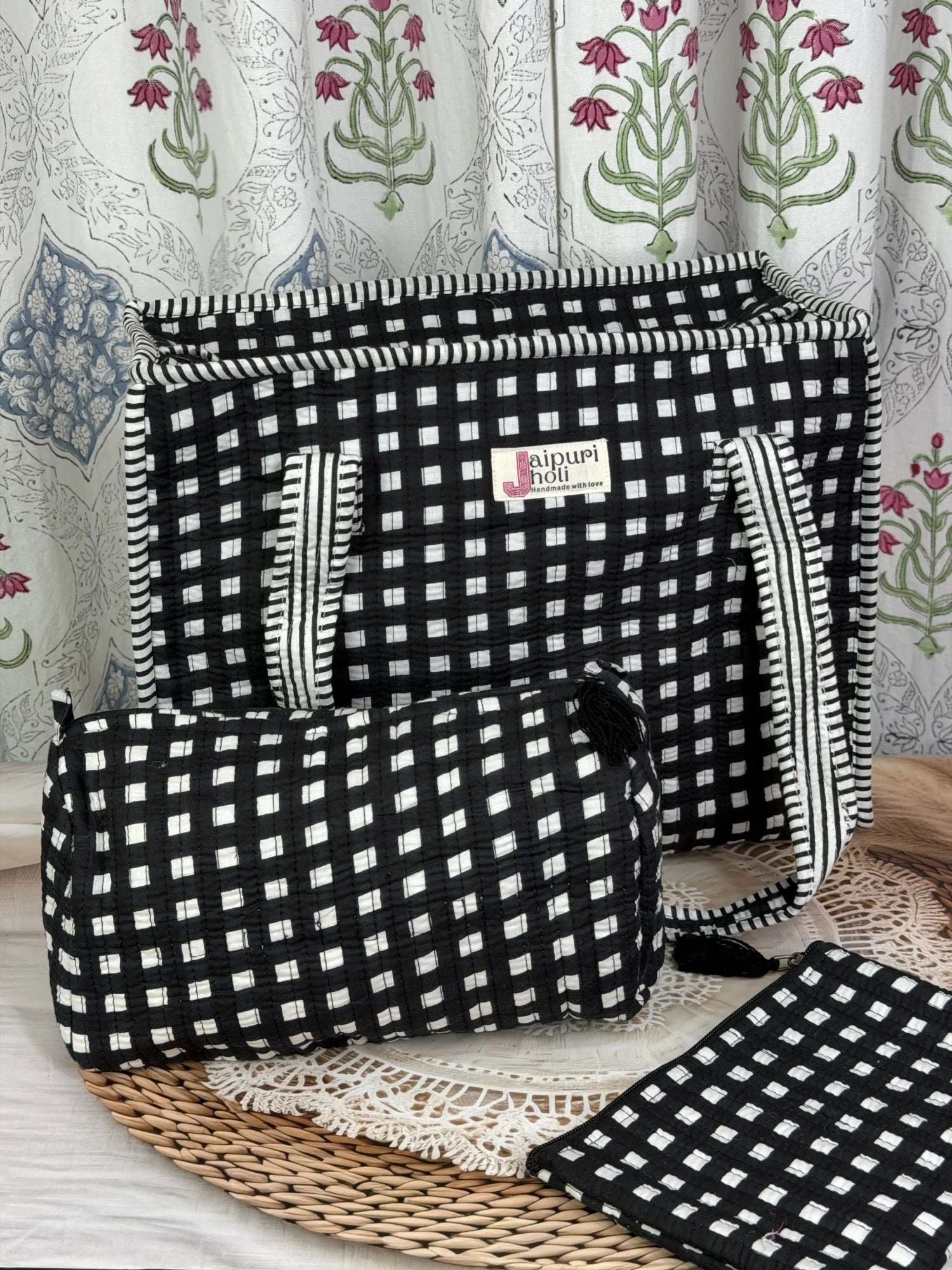 Jaipur block print medium cotton quilted zip tote bag with matching toiletry pouch and flat pouch, black and white geometric check print, 15 × 12 × 6 inch tote, 10 × 6 inch toiletry pouch and 9 × 7 inch flat pouch side view